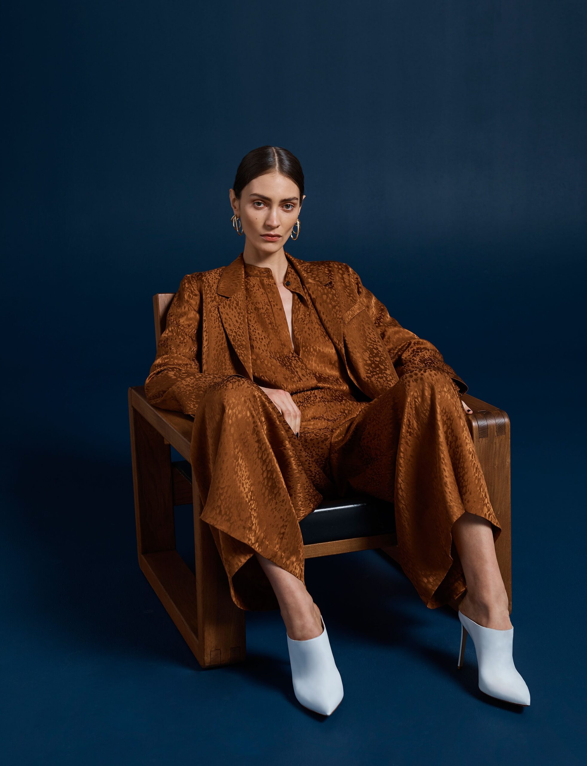 brown silk long-sleeve collared relaxed buttoned textured suit