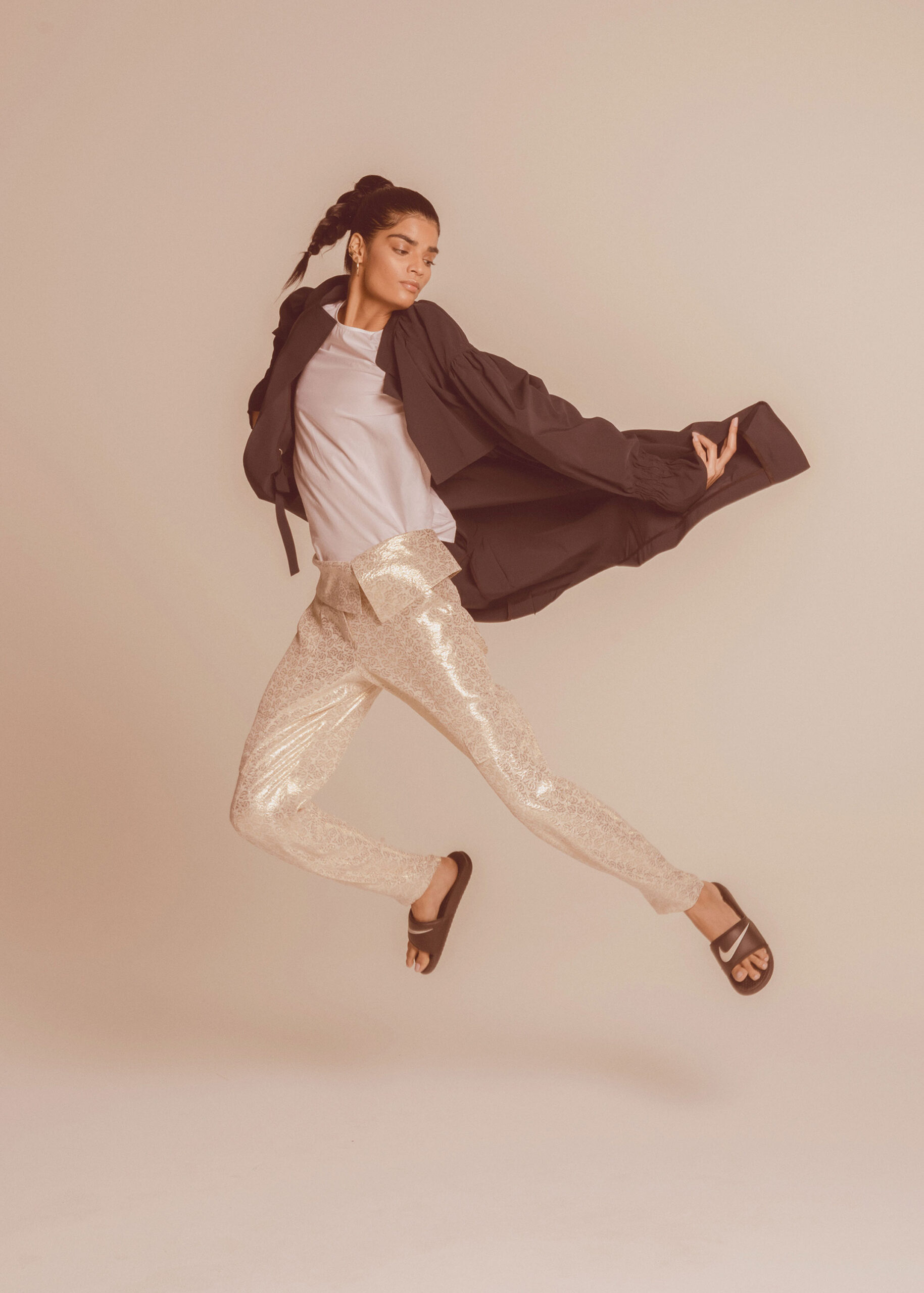 black coat white top gold sequin pants