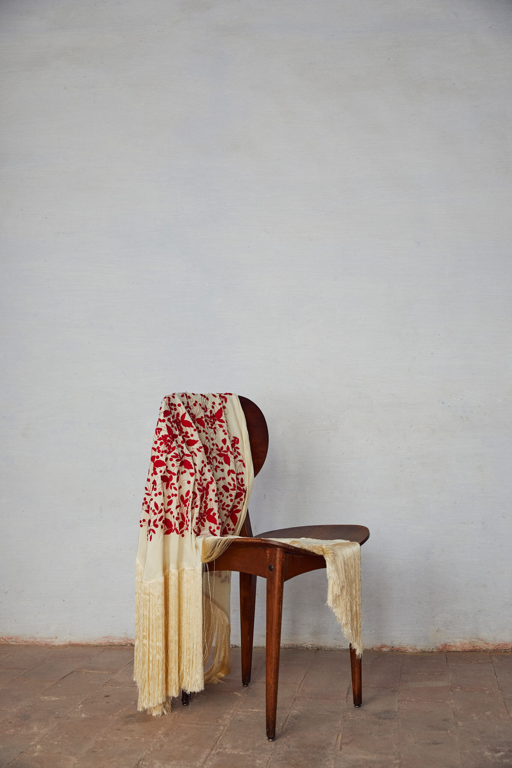 red embroidered fringed scarf