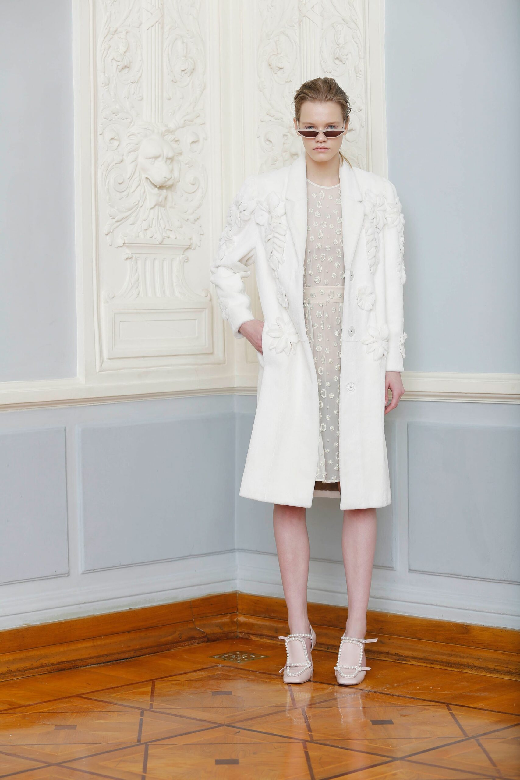 white coat and beige dress