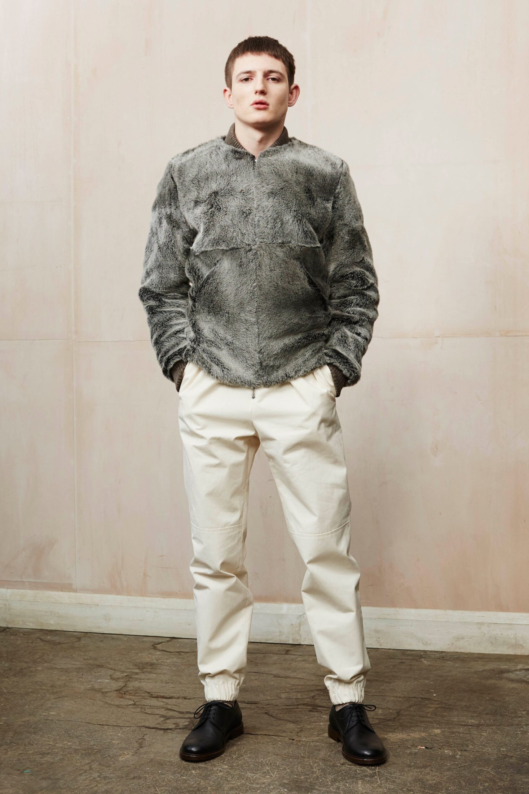 gray faux-fur jacket with white pants