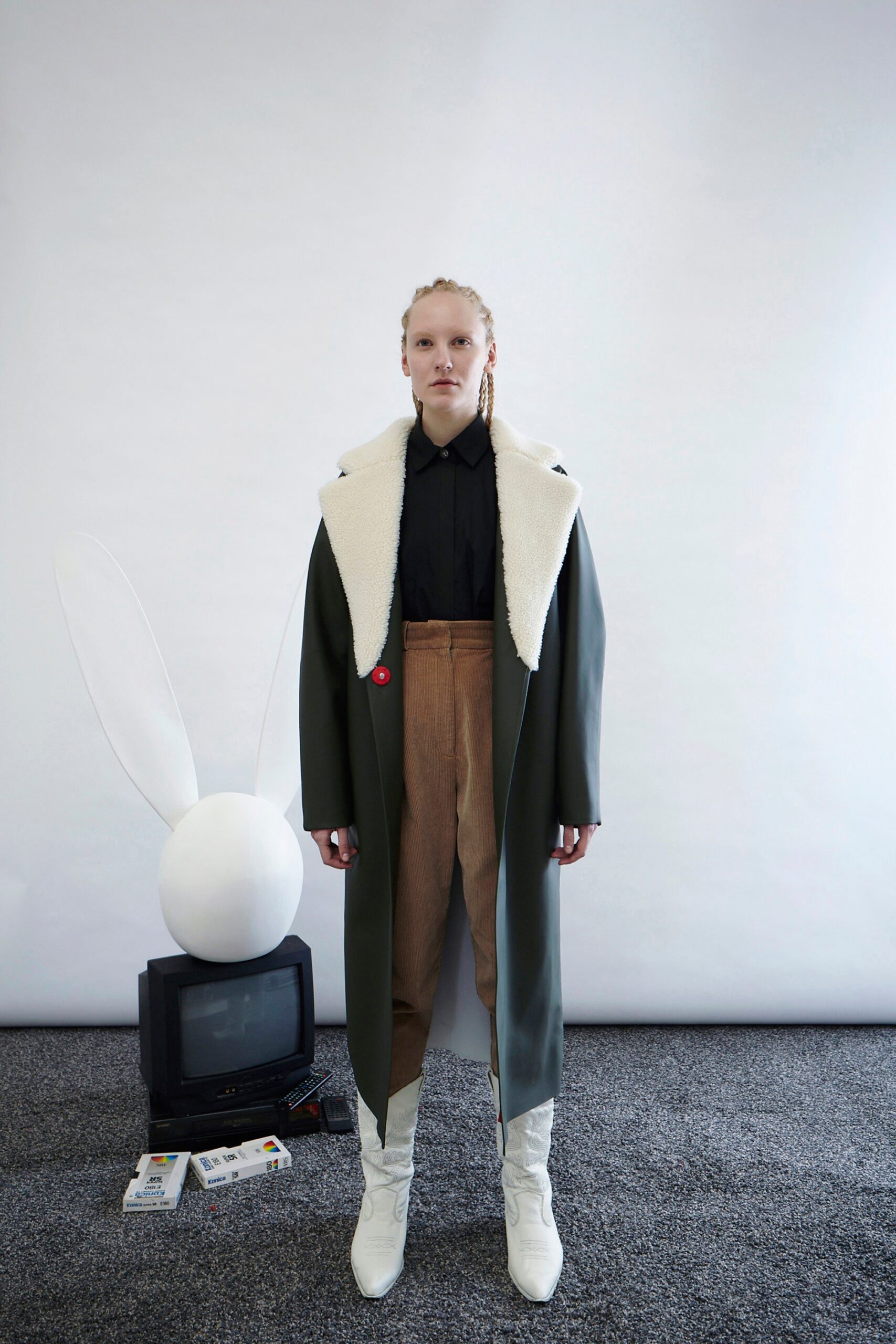 green wool coat with black shirt