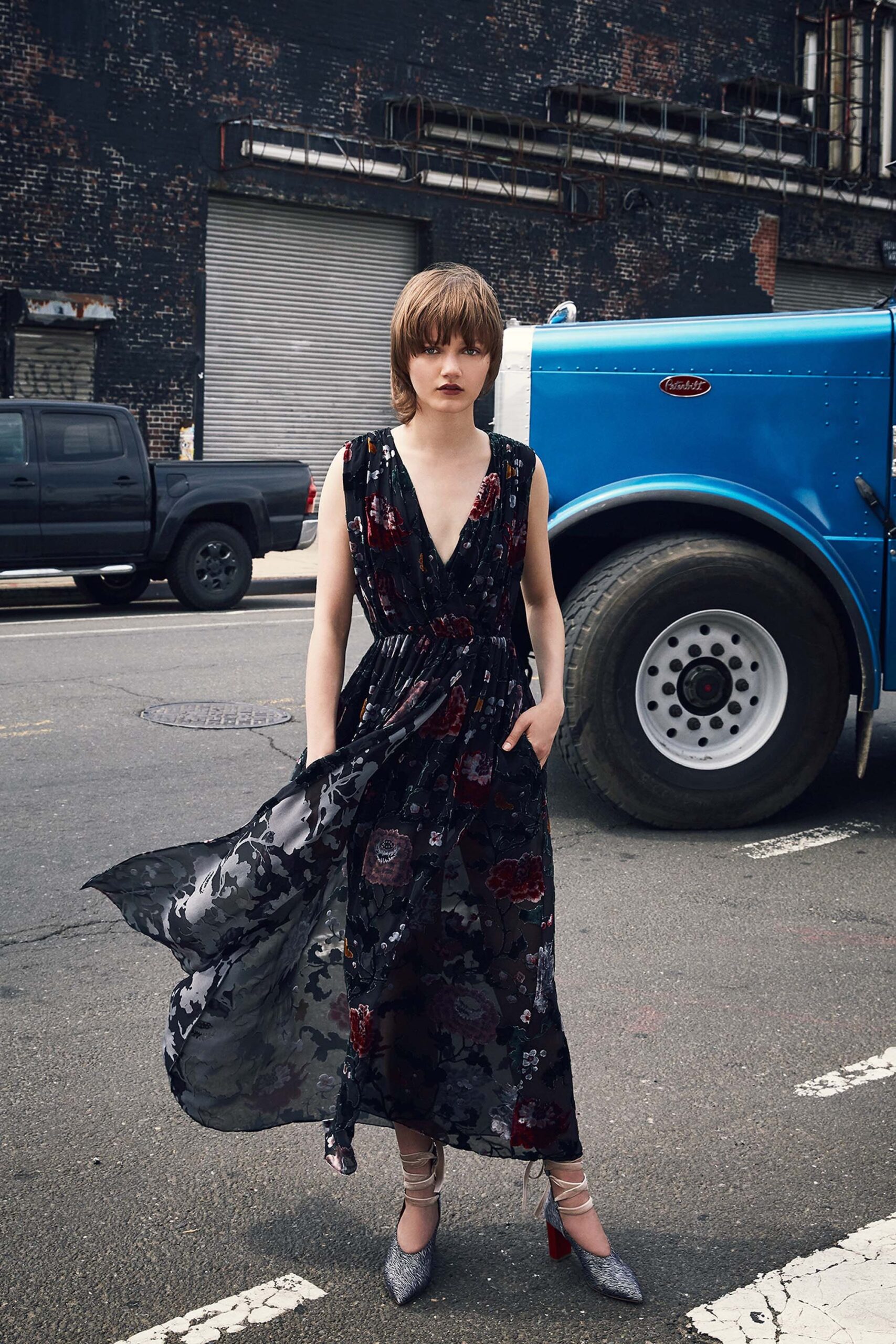 black floral silk midi dress with silver shoes