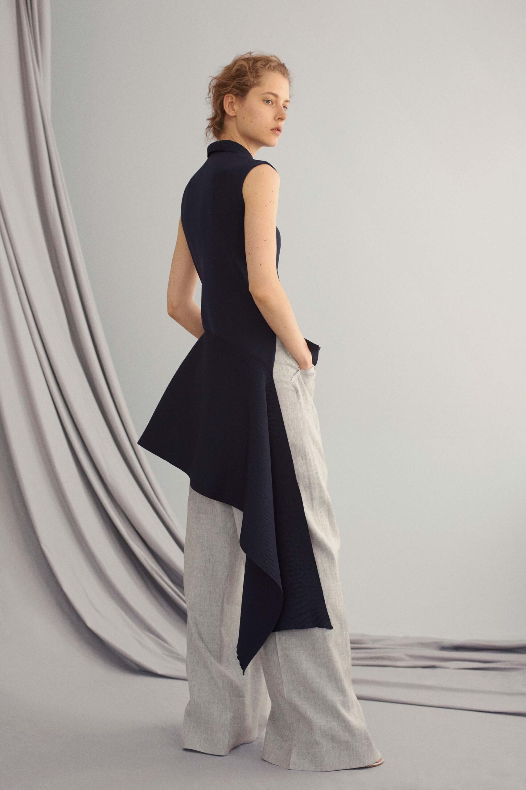 navy fitted top with gray wide-leg pants