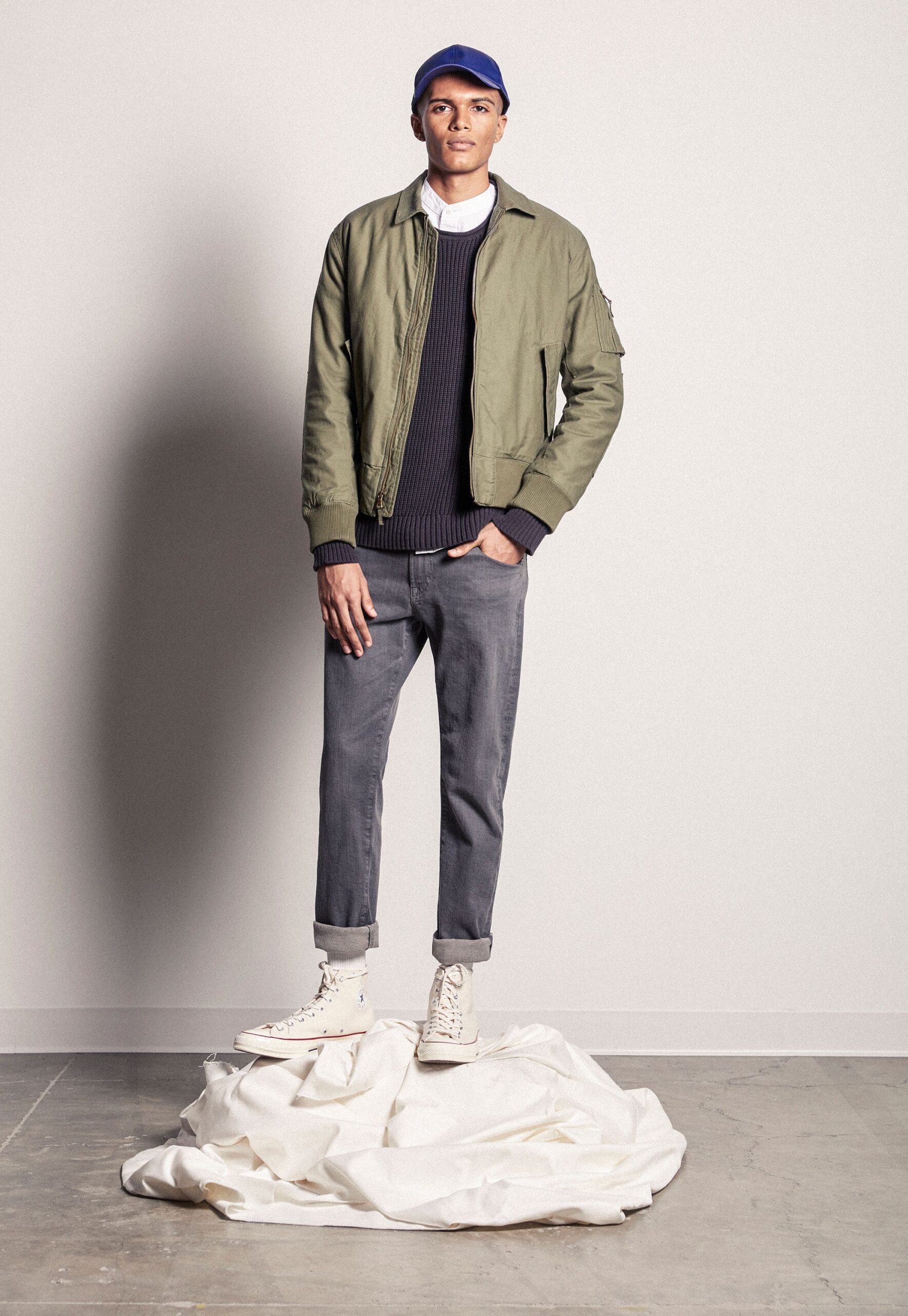 green jacket navy sweater gray pants