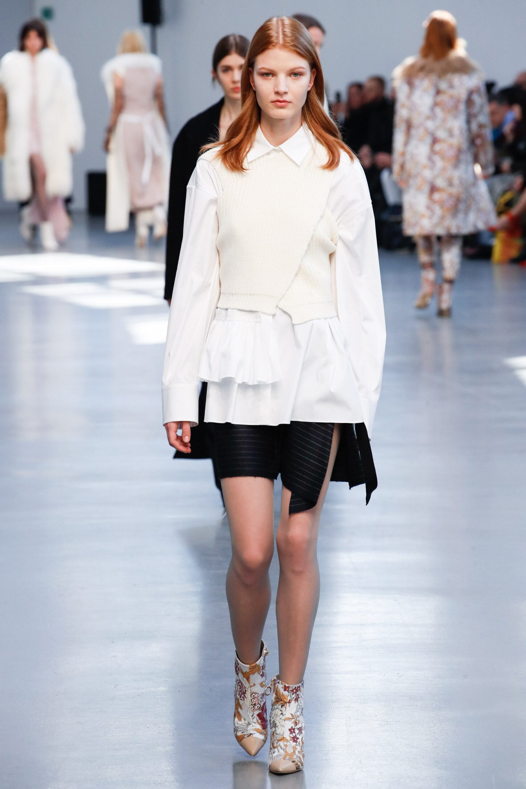 white blouse black pleated skirt