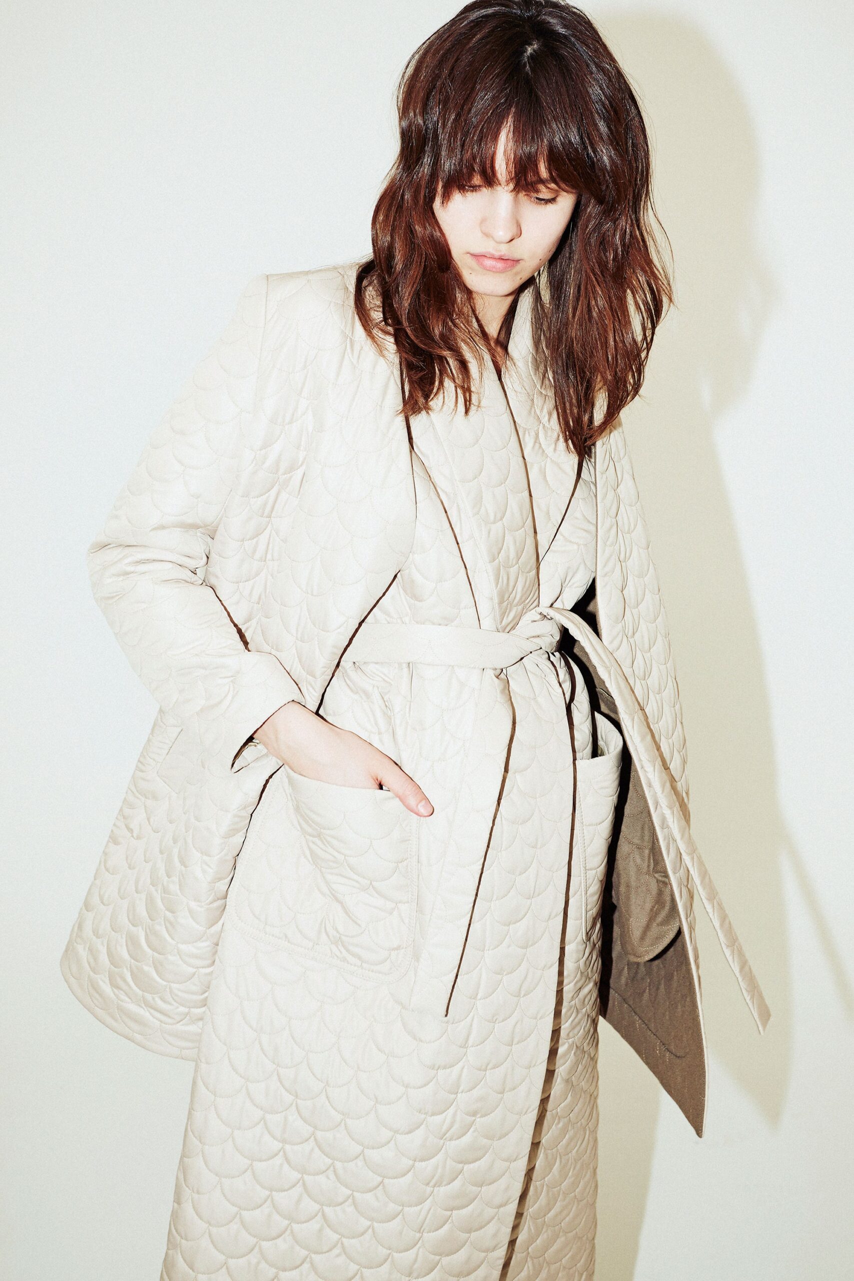 beige quilted coat and dress