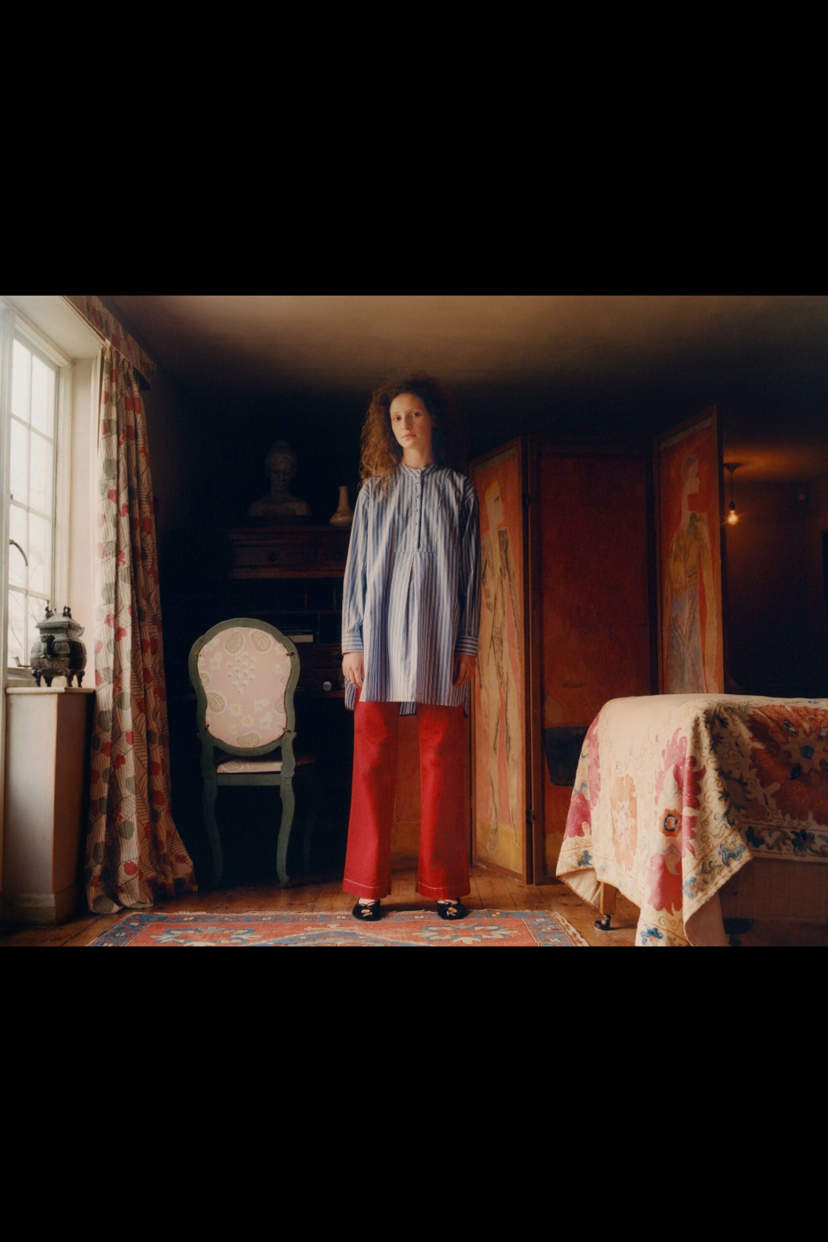 blue striped shirt and red wide-leg pants