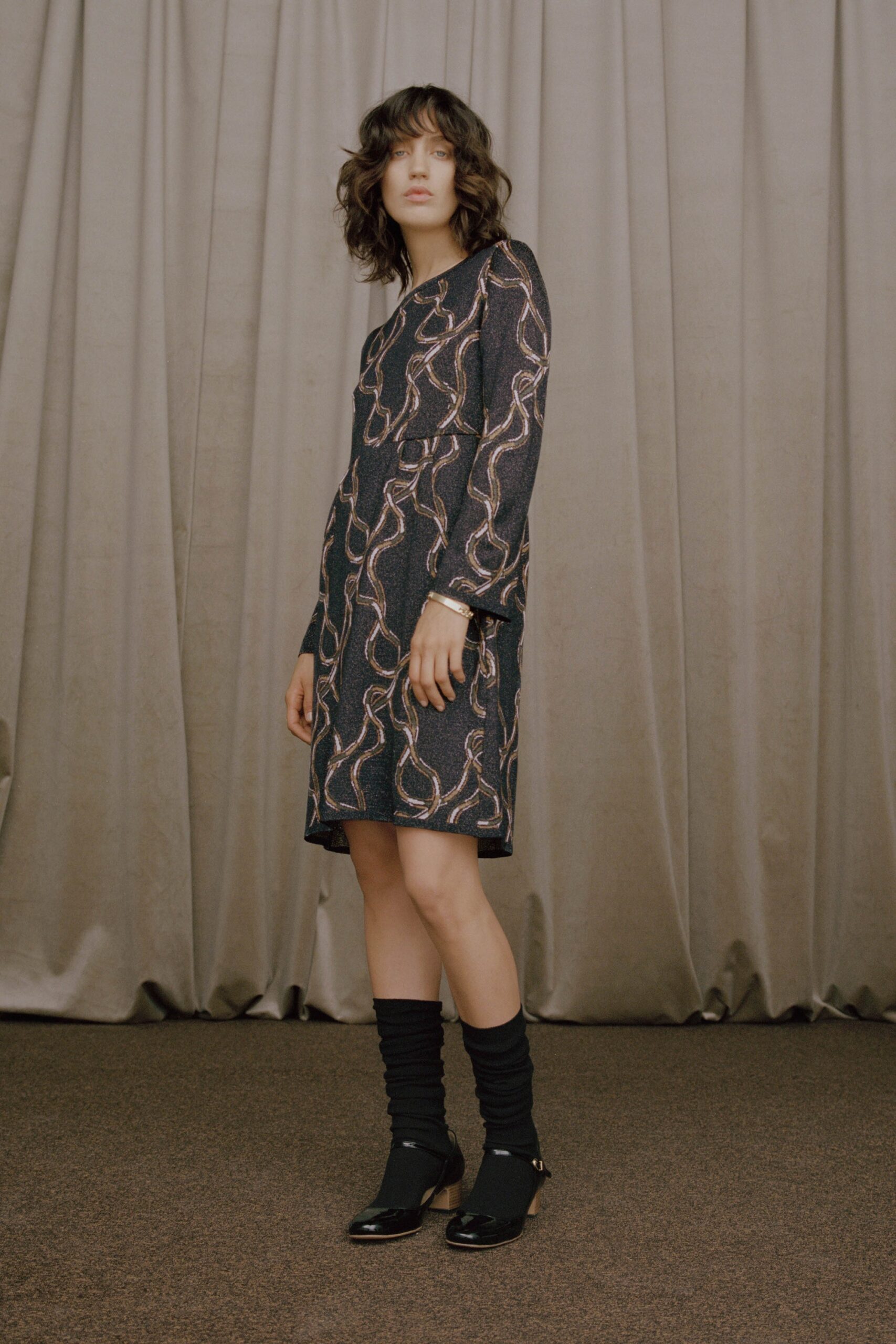 black and gold printed midi dress