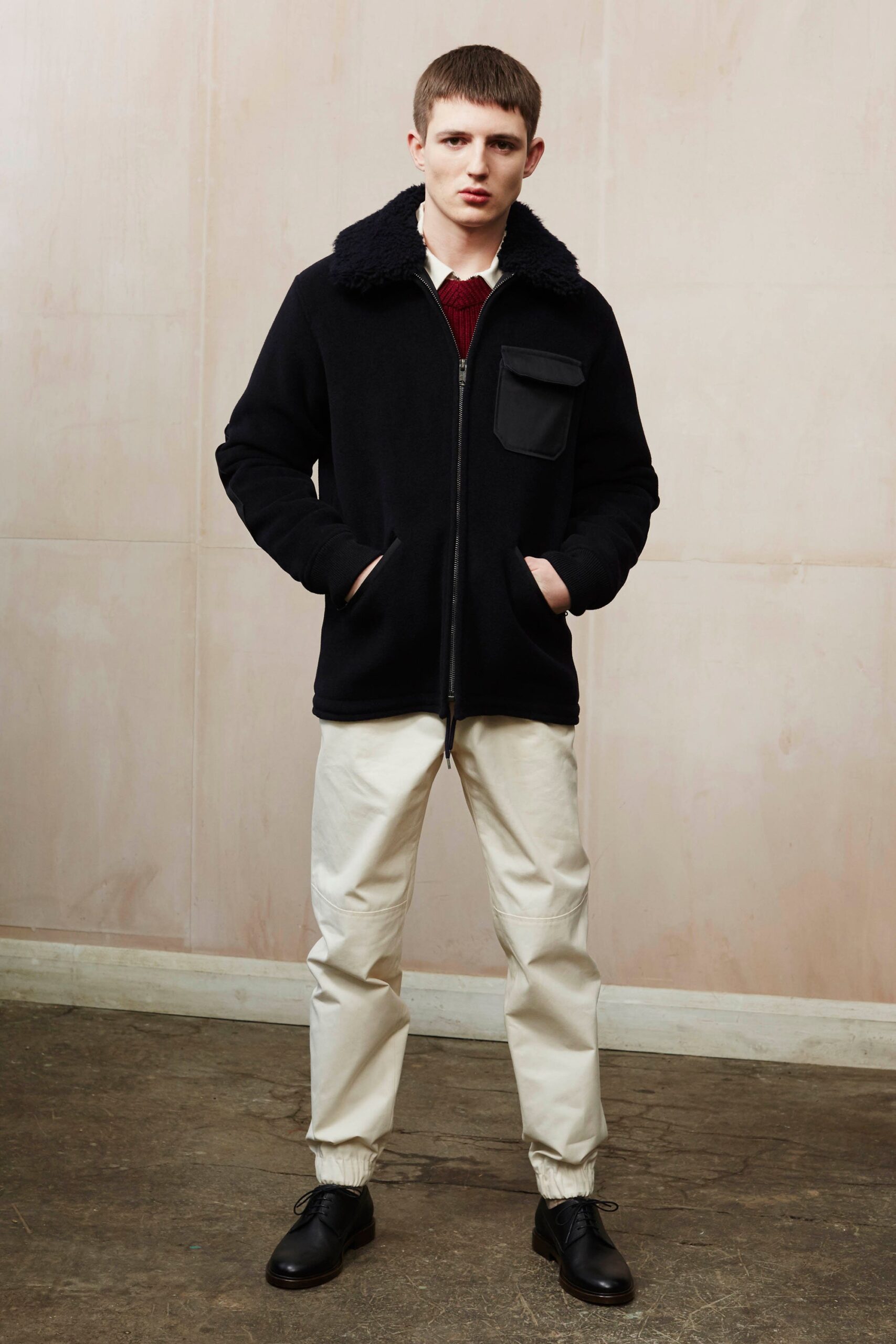 black wool relaxed jacket and beige pants