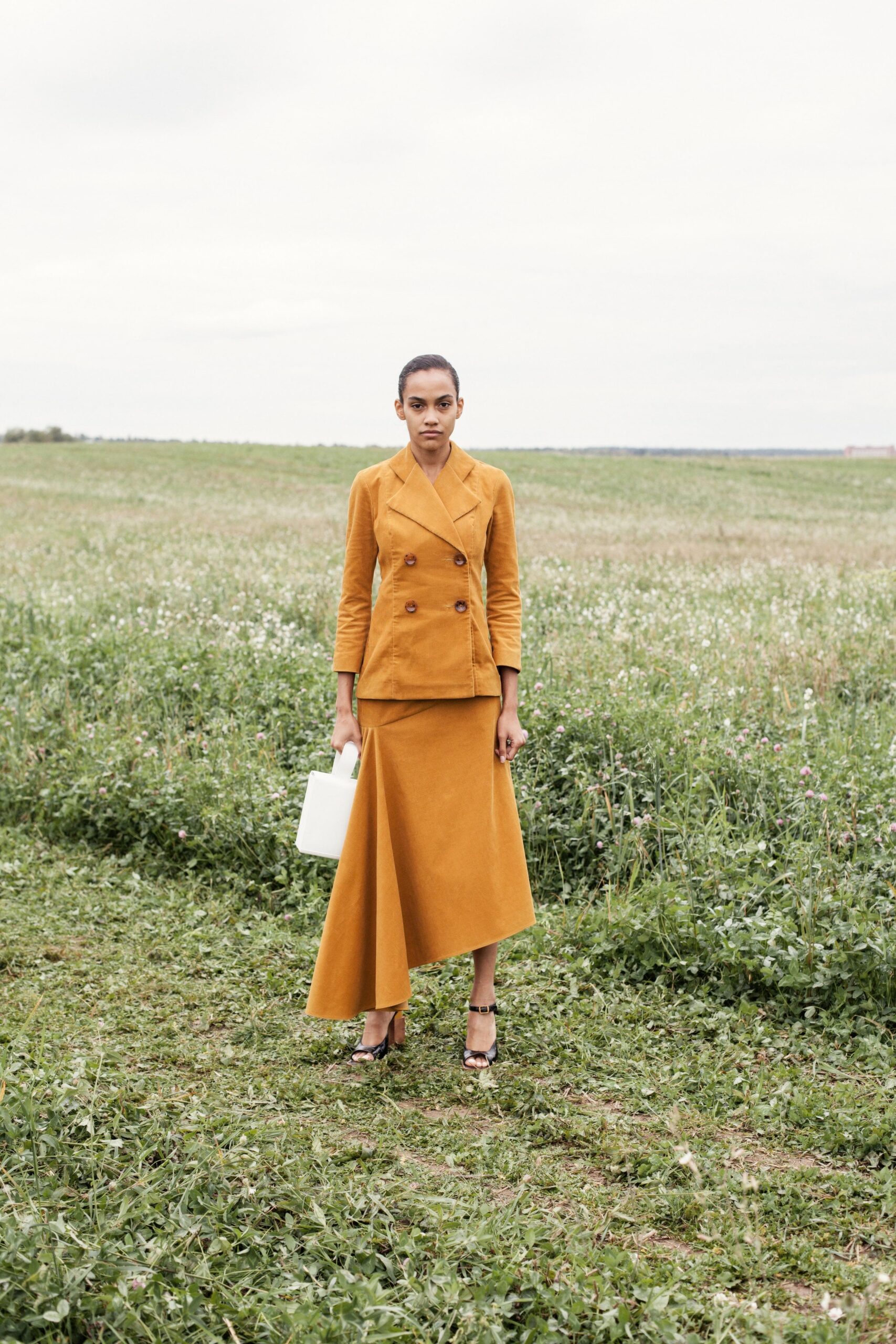 yellow tailored blazer and skirt