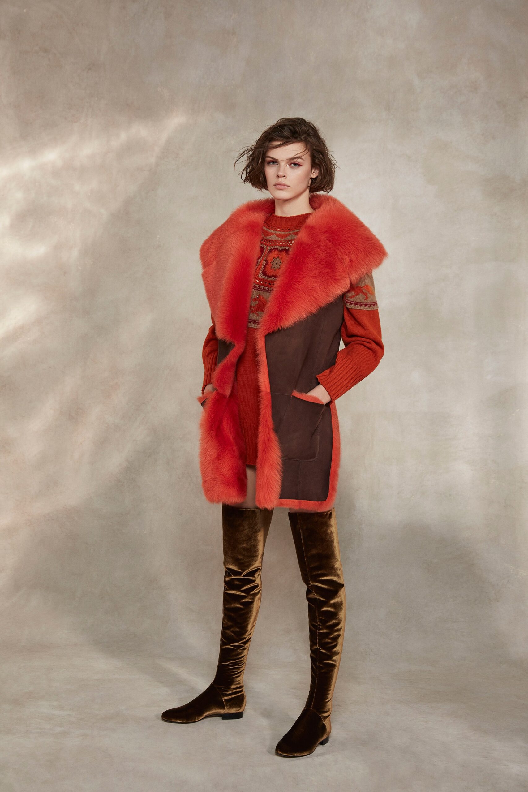 orange fur coat with red sweater
