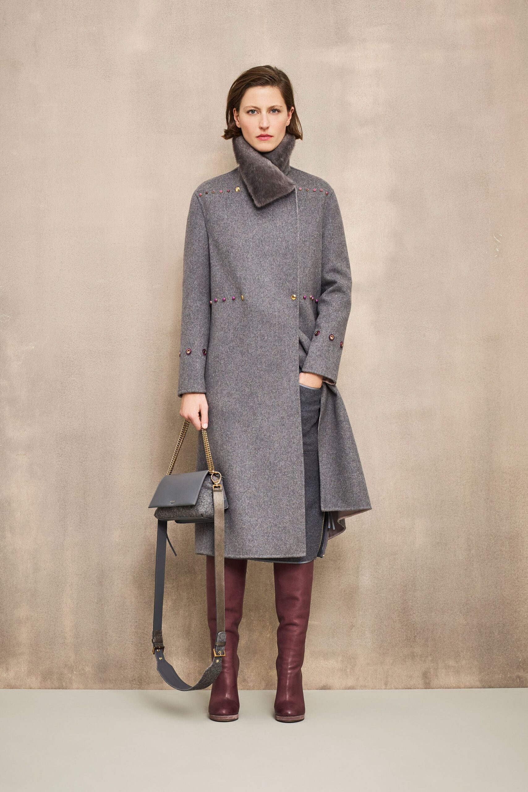 gray wool fitted coat with burgundy boots