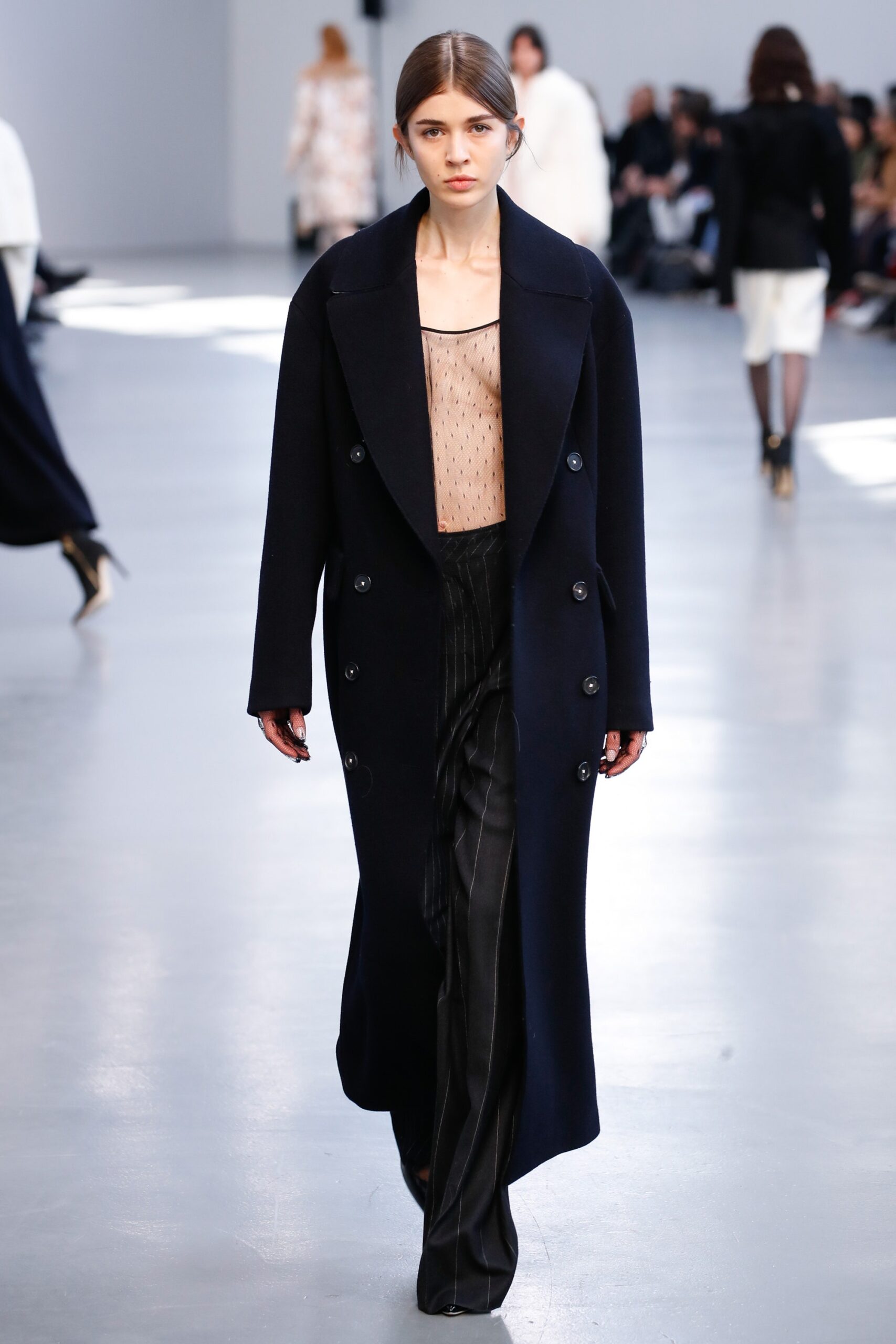 black wool coat beige silk top tailored pants