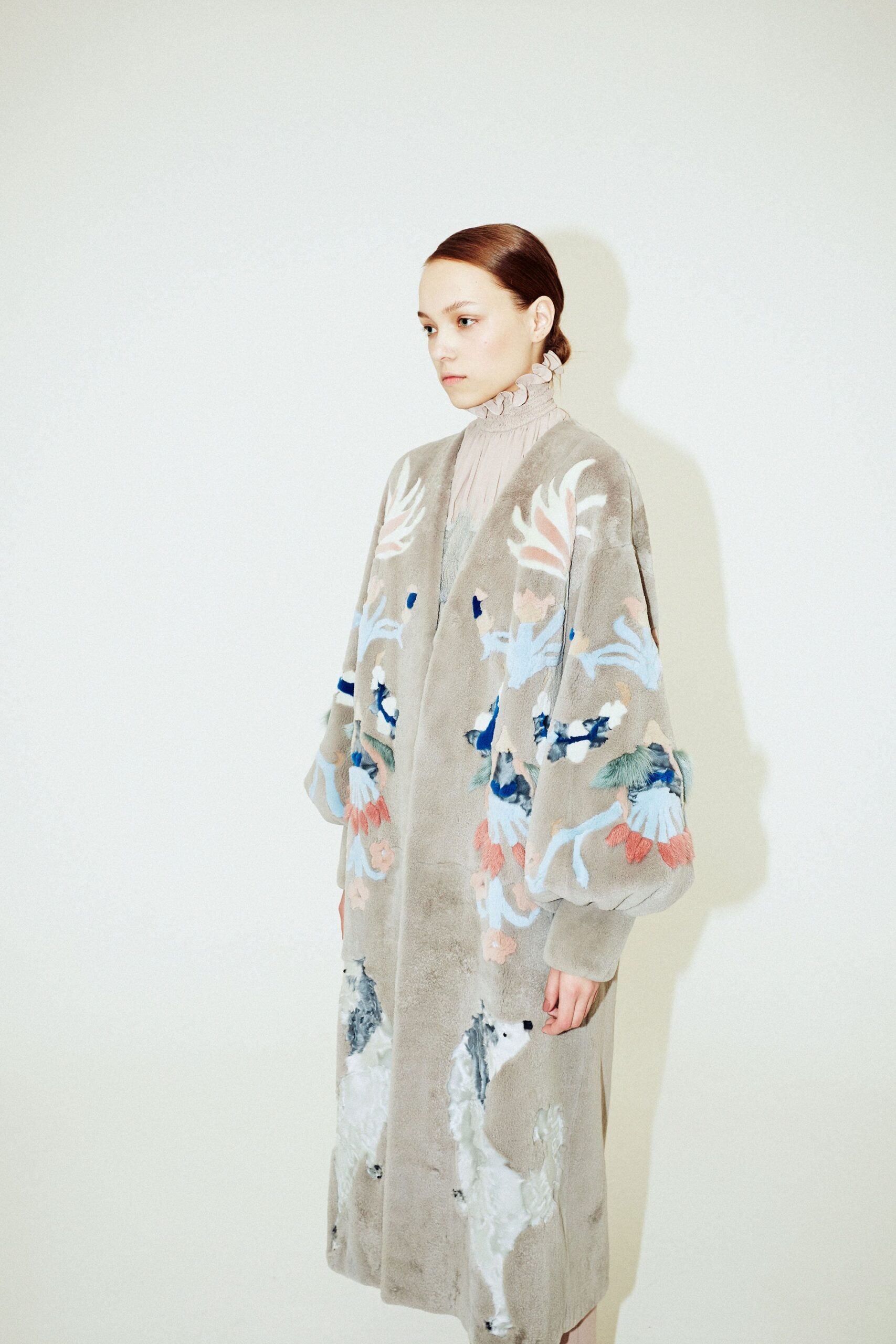 gray velvet embroidered coat and beige silk blouse