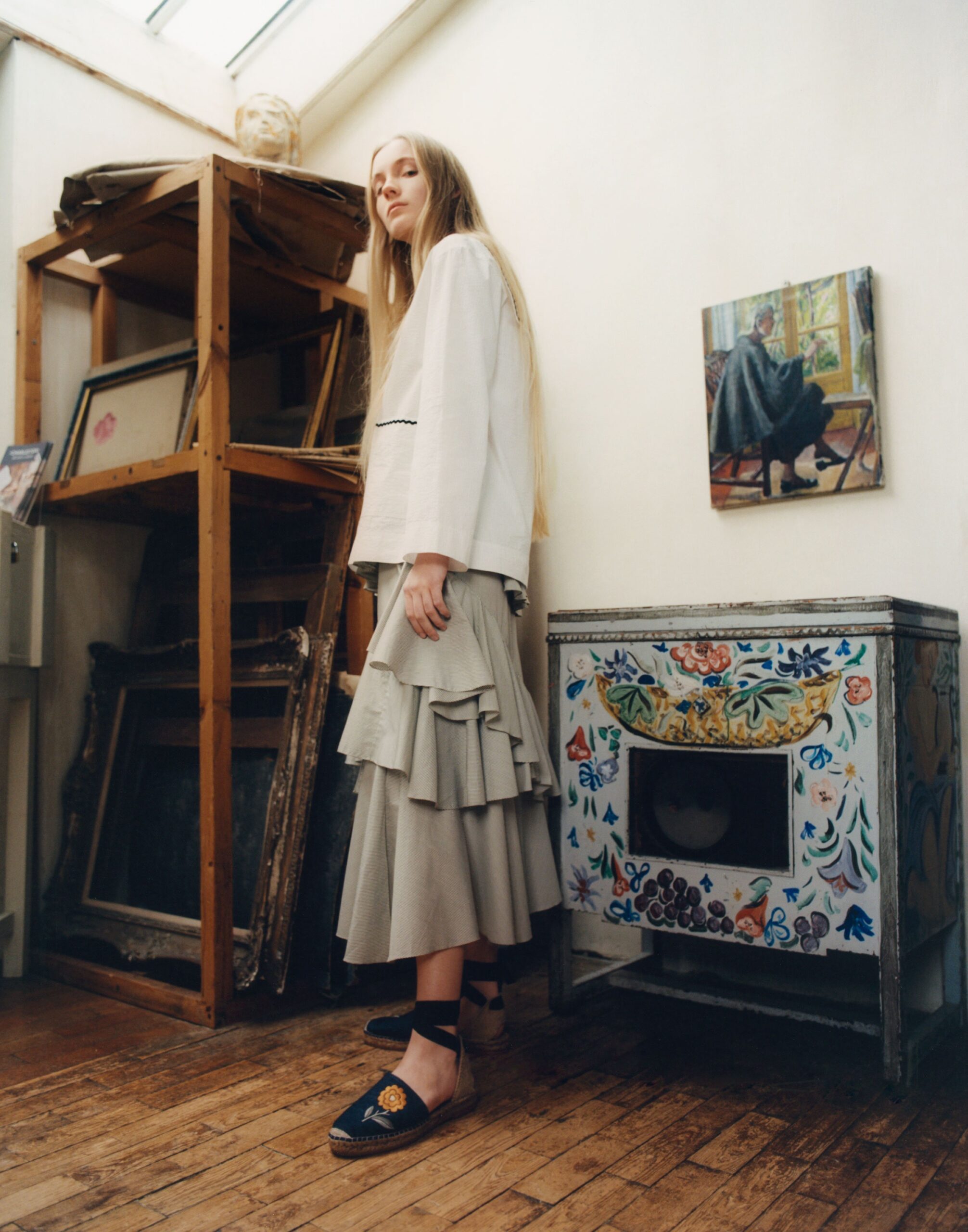white relaxed blouse with gray tiered skirt