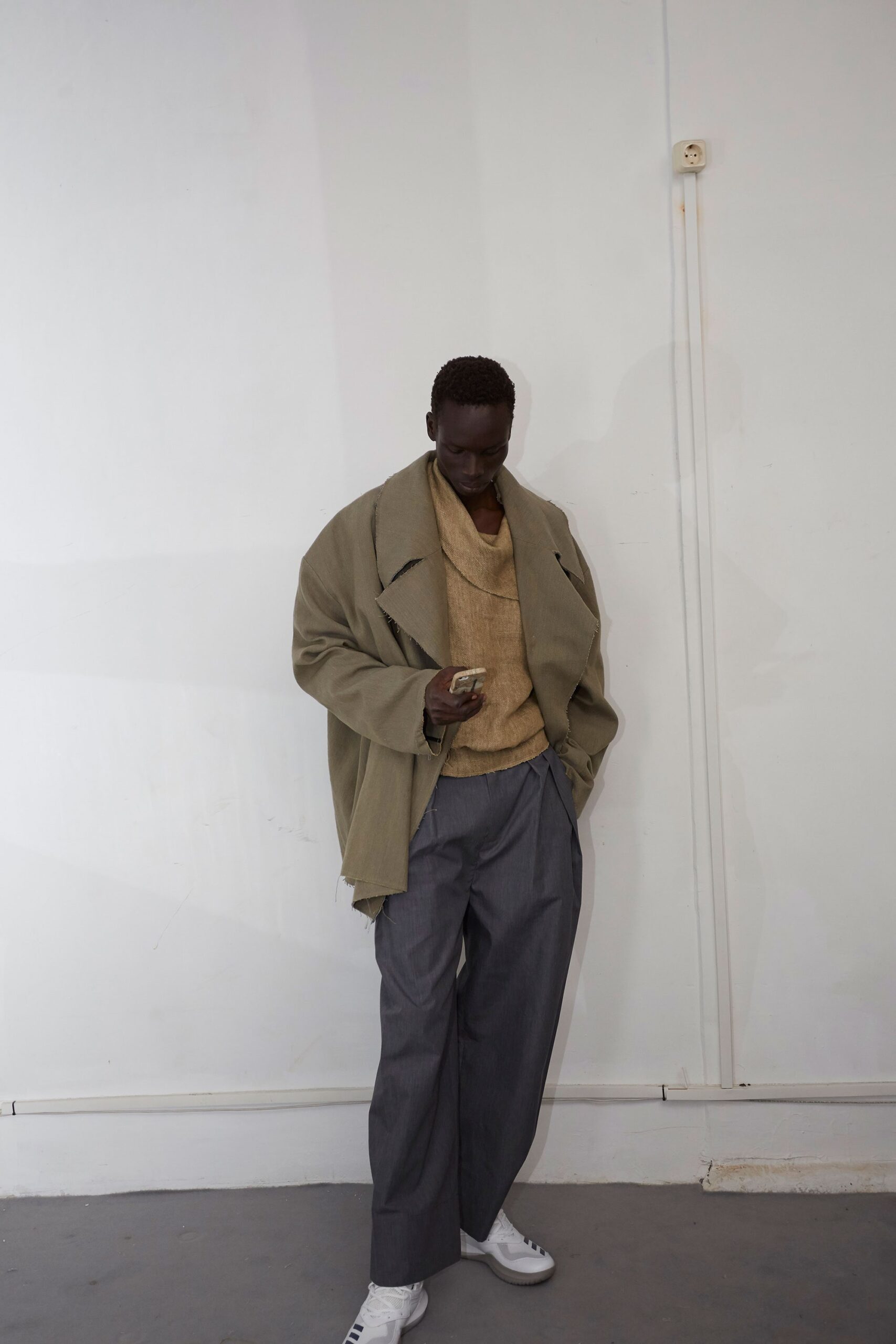 relaxed green jacket with beige sweater