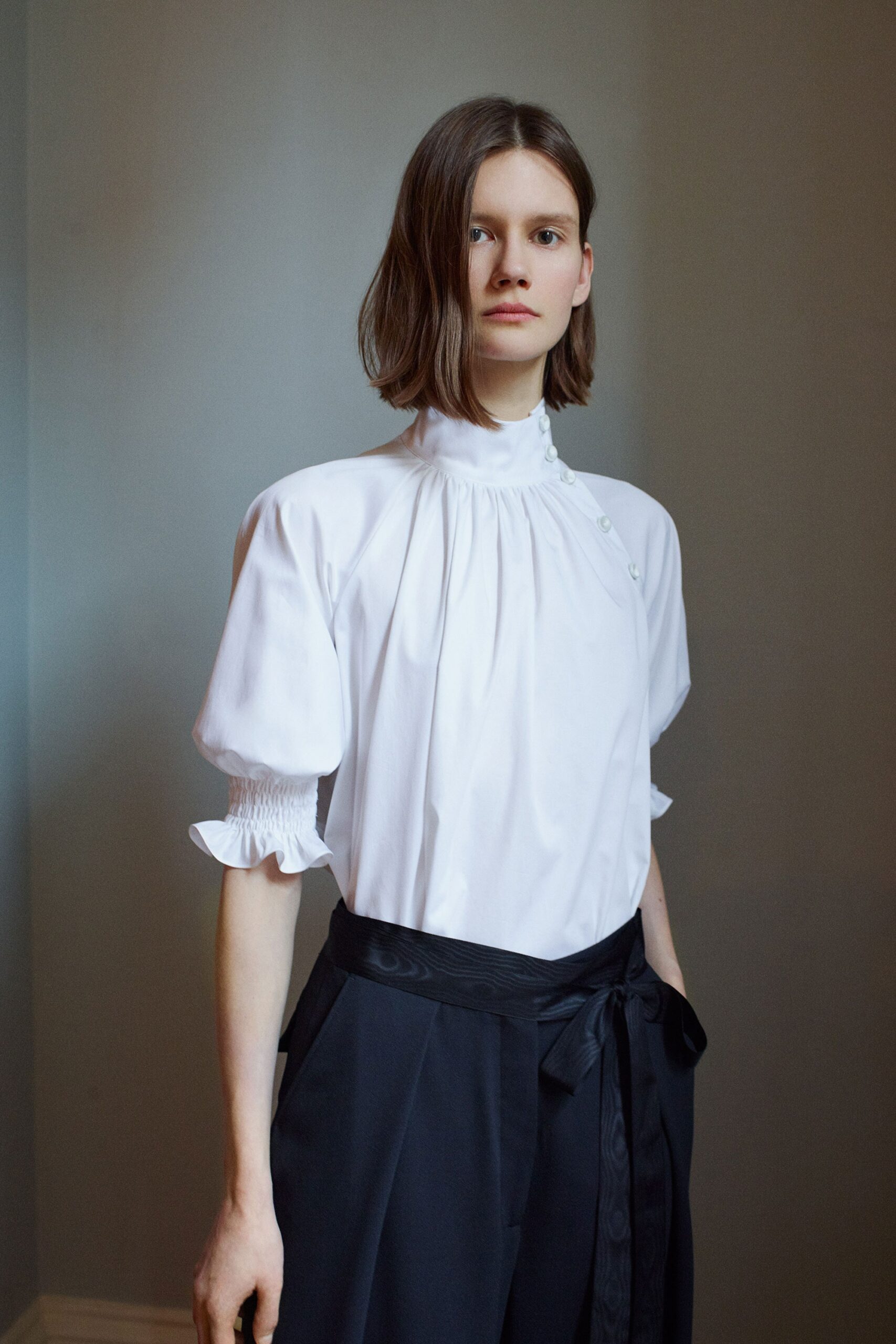 white fitted blouse and black pants