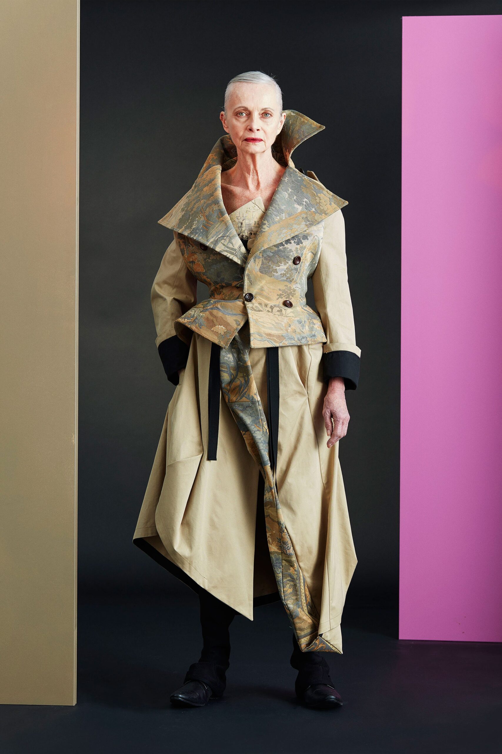 beige gold draped coat with black top