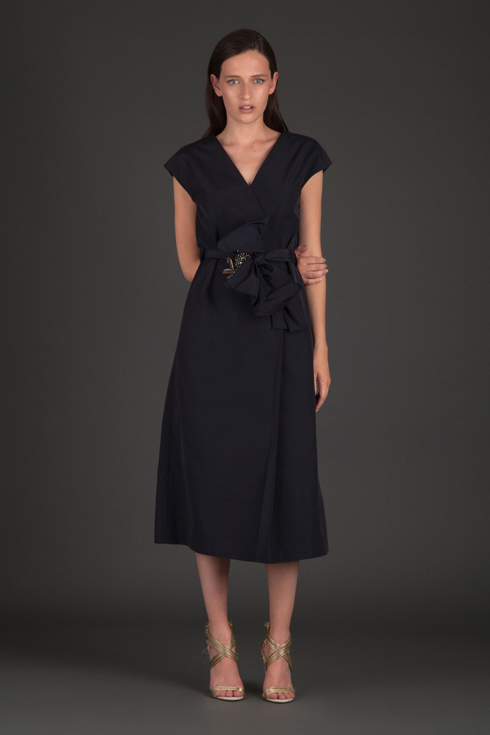black midi dress with gold shoes