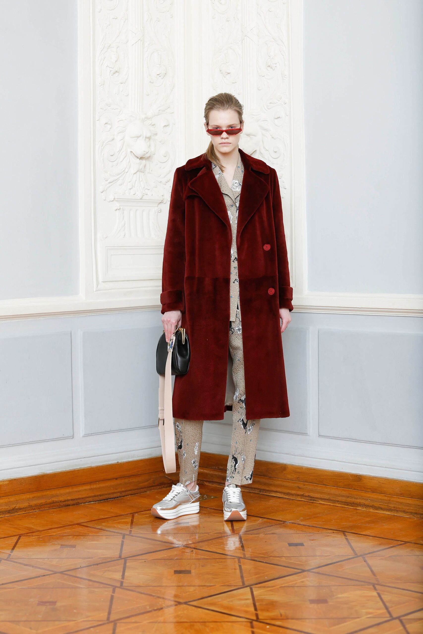 red faux-fur coat with printed suit