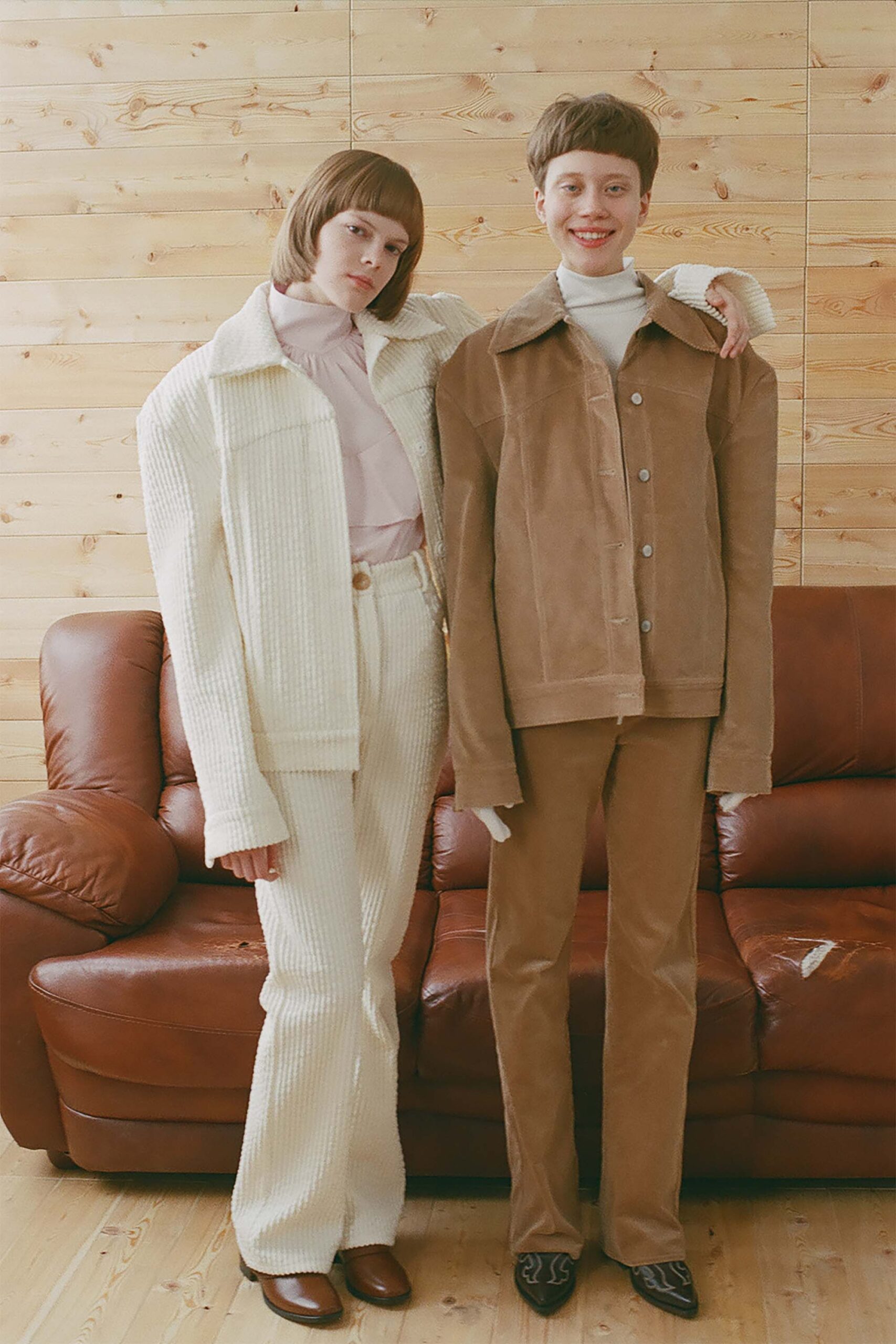 oversized white jacket and fitted brown pants