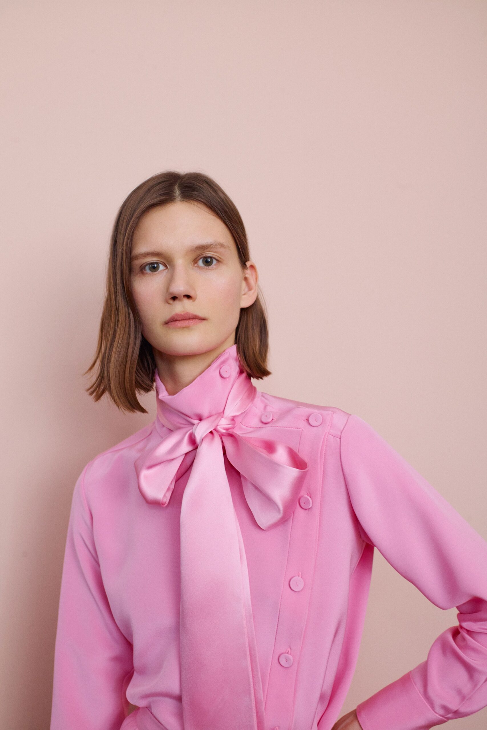 fitted pink silk blouse