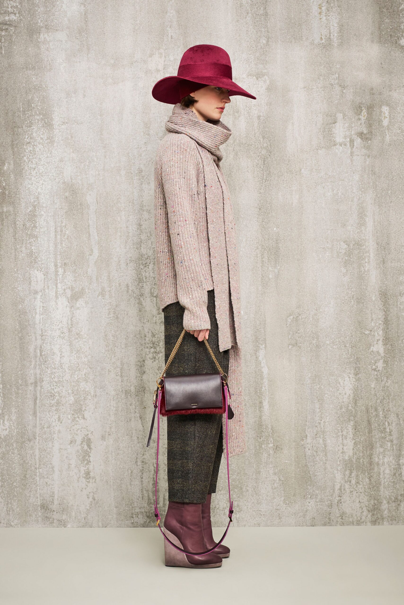 pink relaxed sweater with gray tailored pants