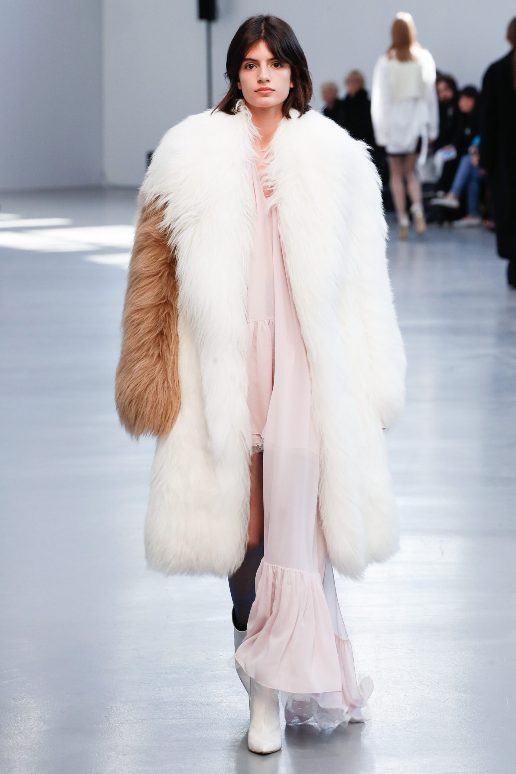 oversized faux-fur coat and pink dress