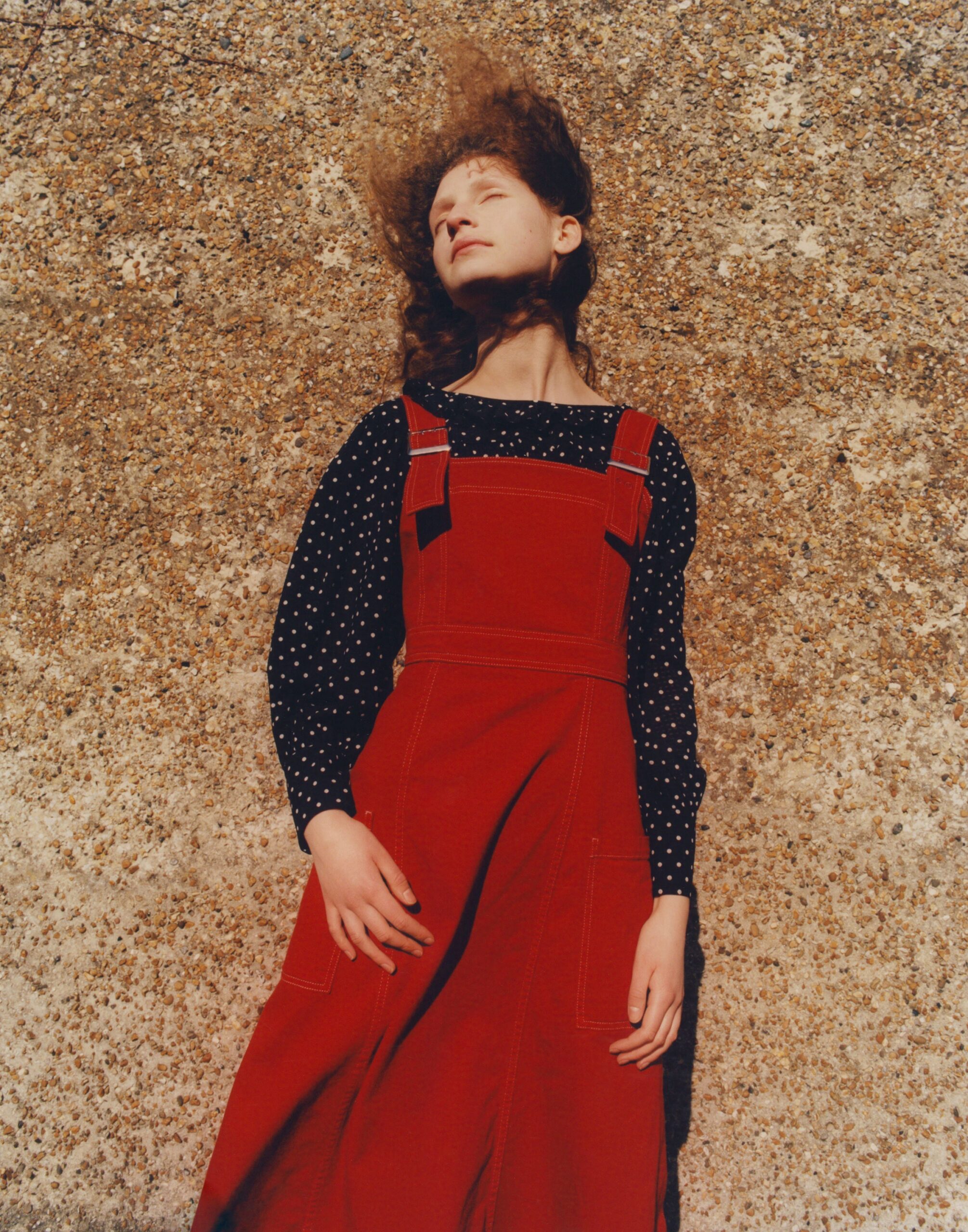 red cotton jumpsuit with black polka-dot top