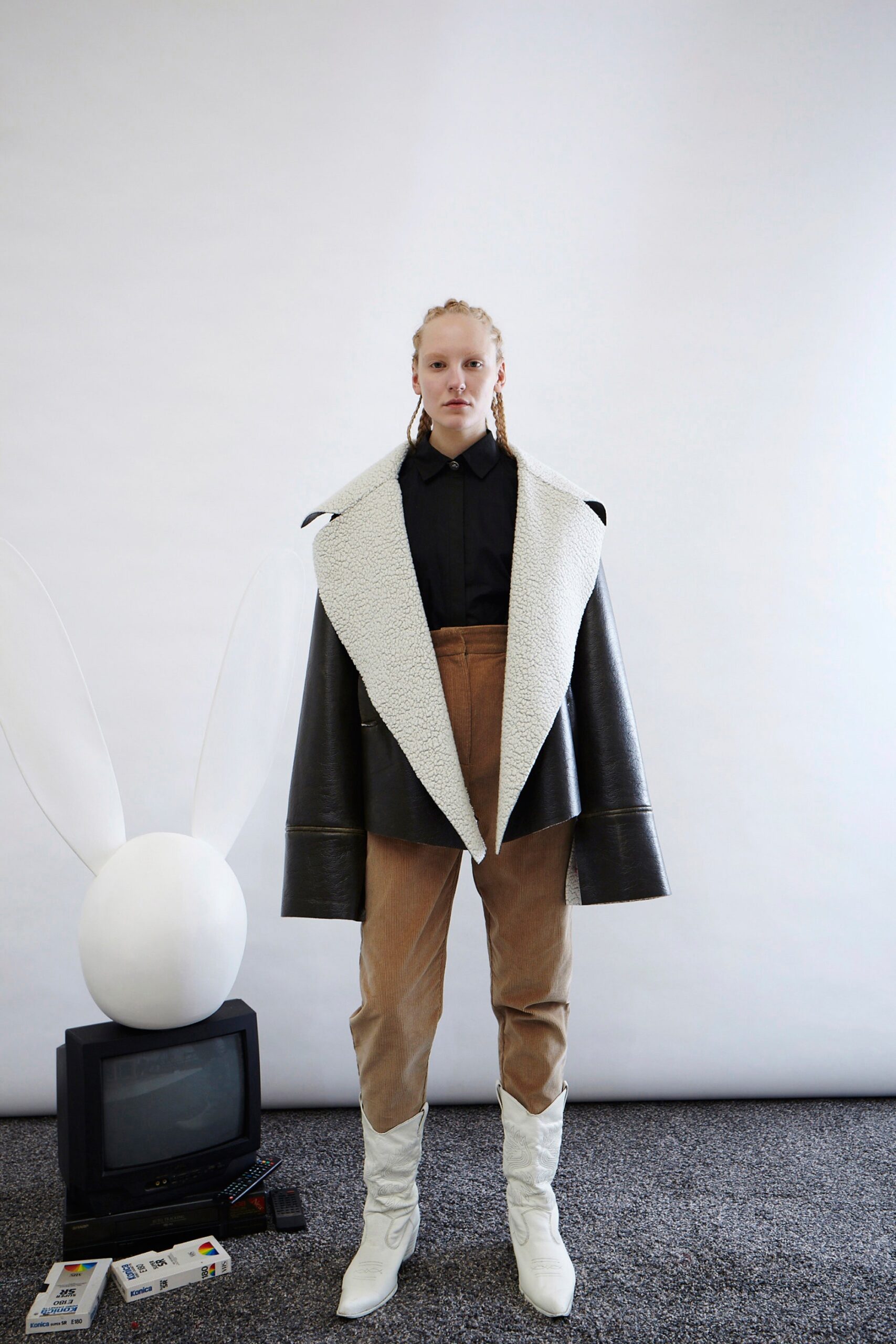 black and white relaxed jacket with brown pants
