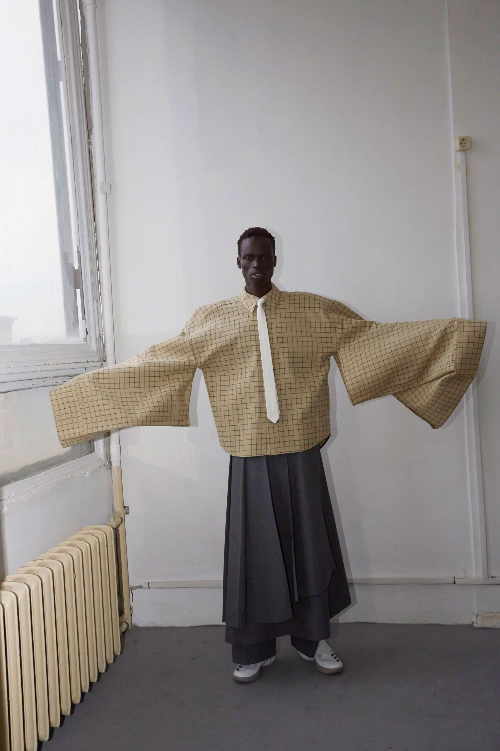 oversized checked shirt and pleated skirt