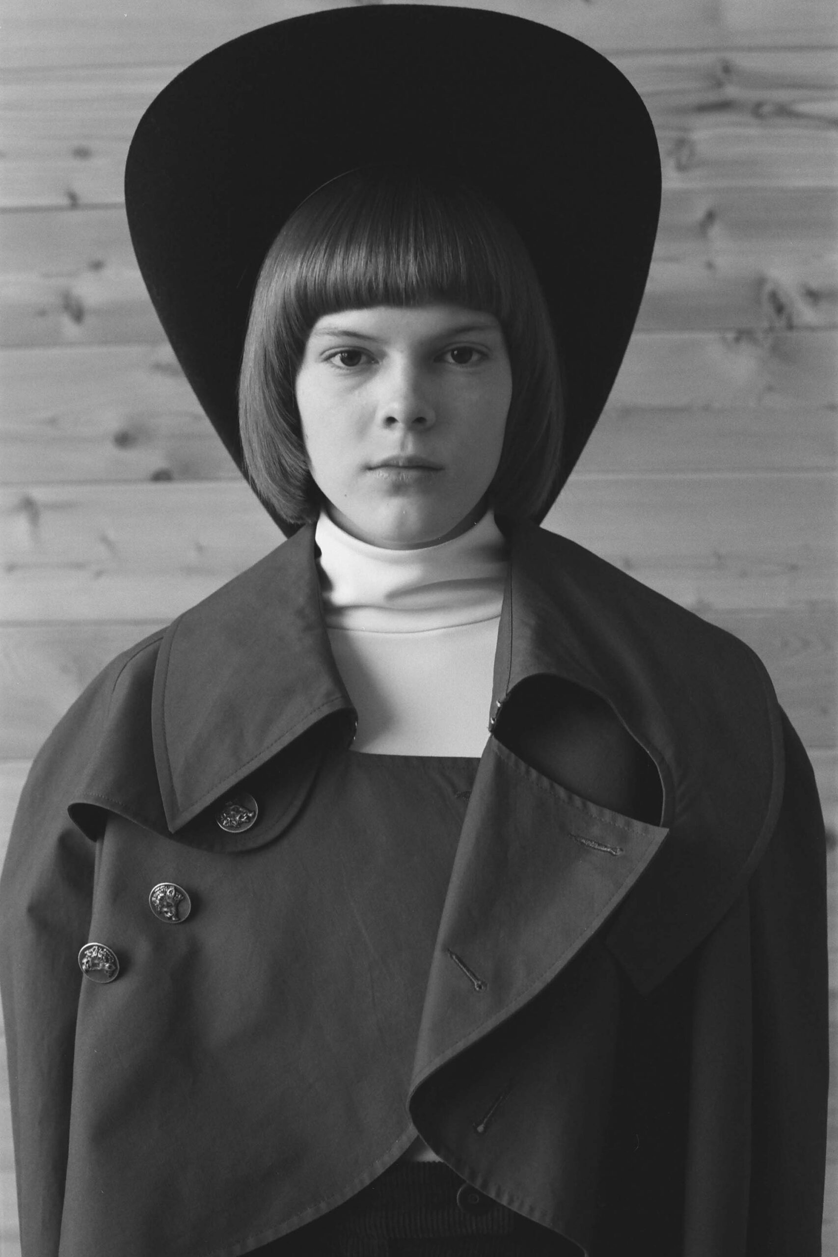 black coat white top black hat