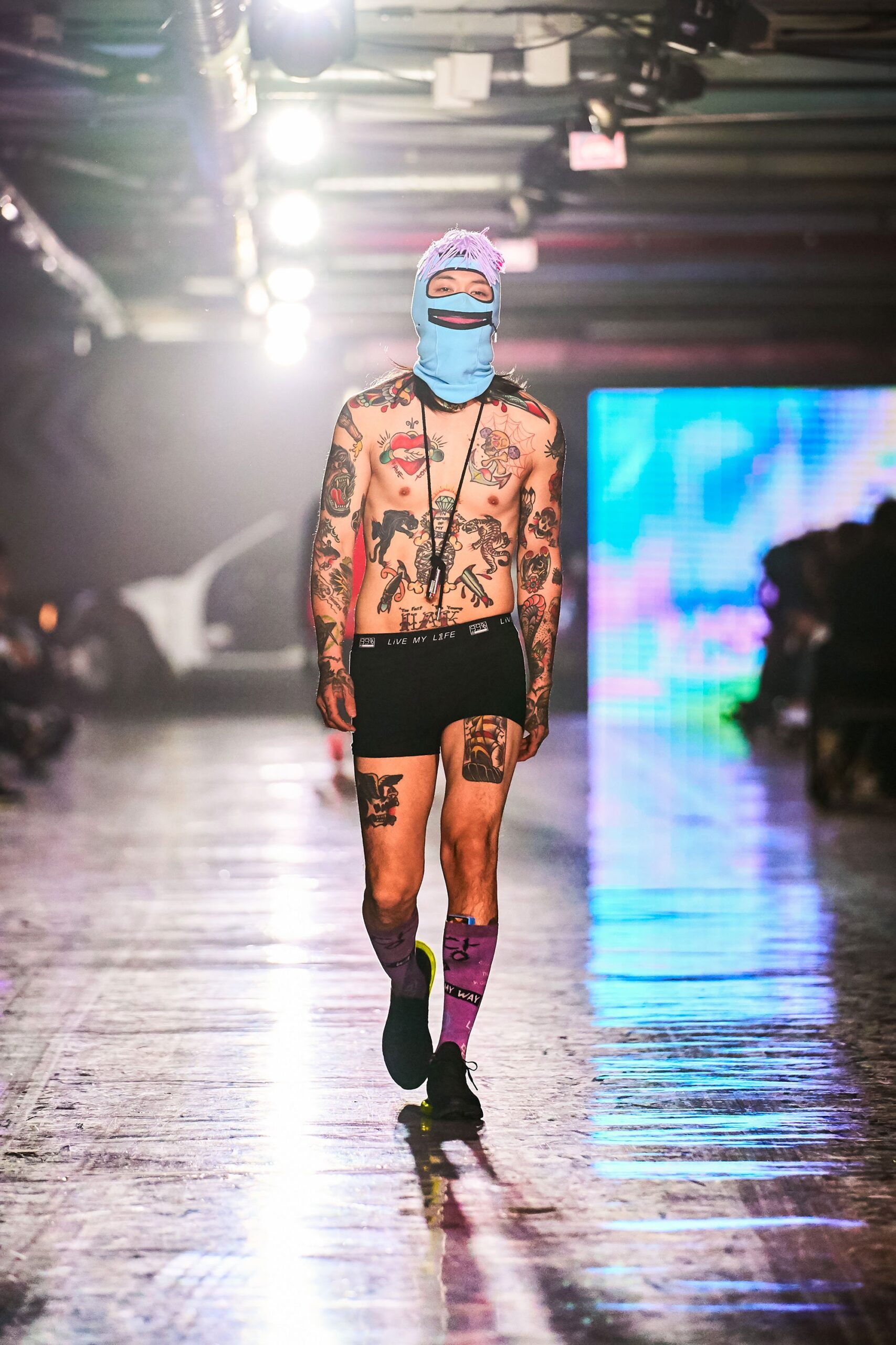 Fitted black shorts with a printed design, showcasing a unique streetwear style.