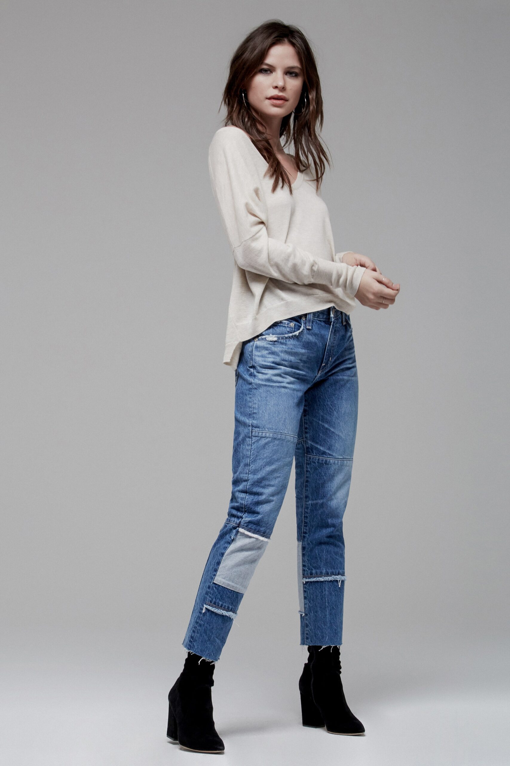 beige relaxed top with blue jeans