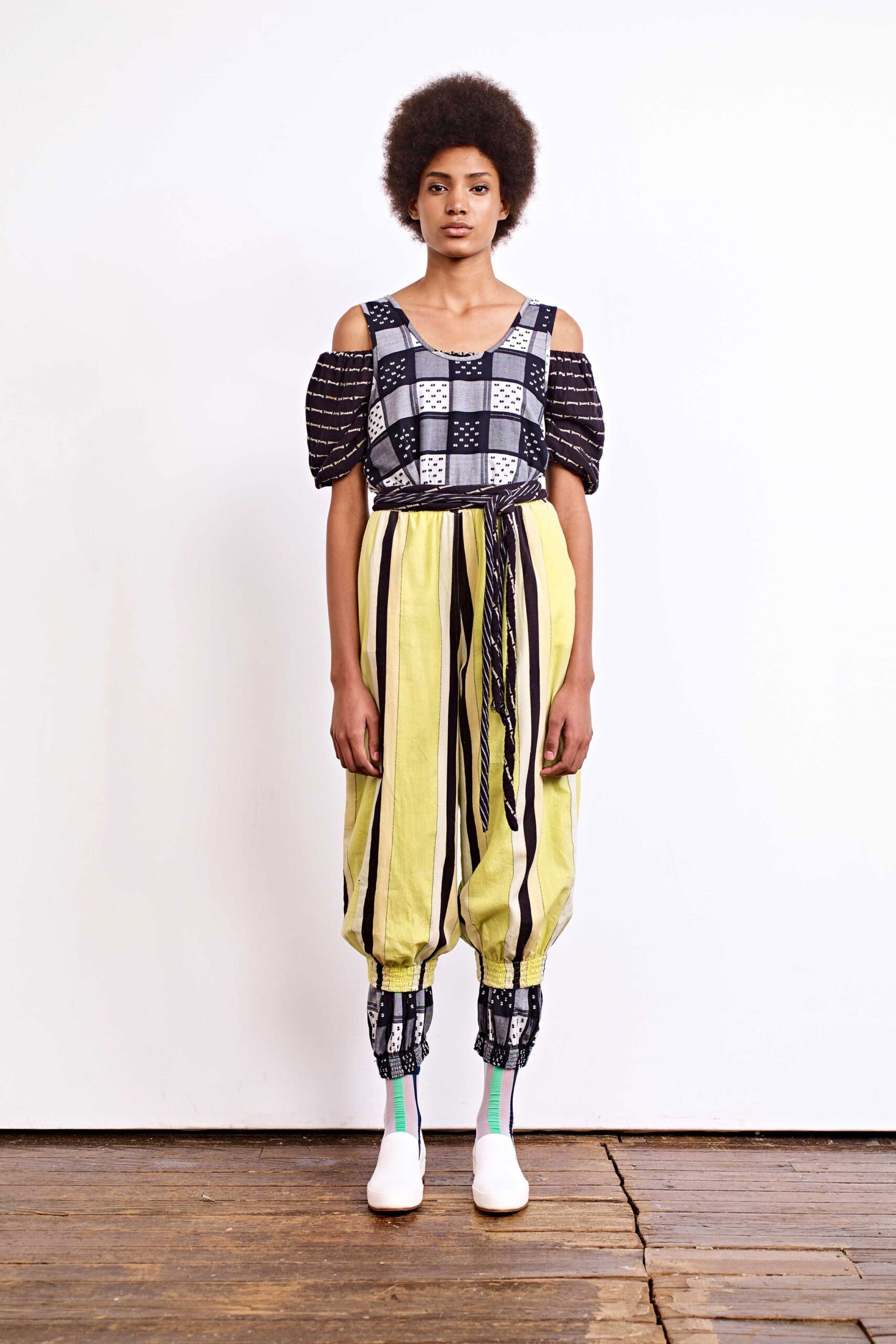 checked off-shoulder top with striped pants
