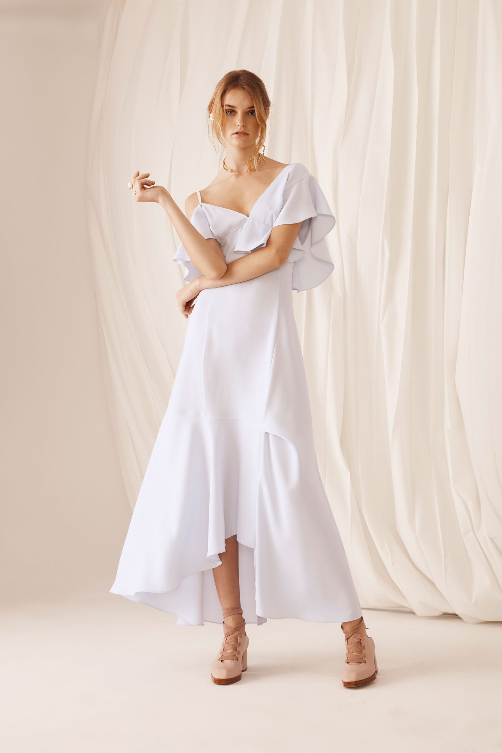 white silk sleeveless v-neck fitted flared flowing dress
