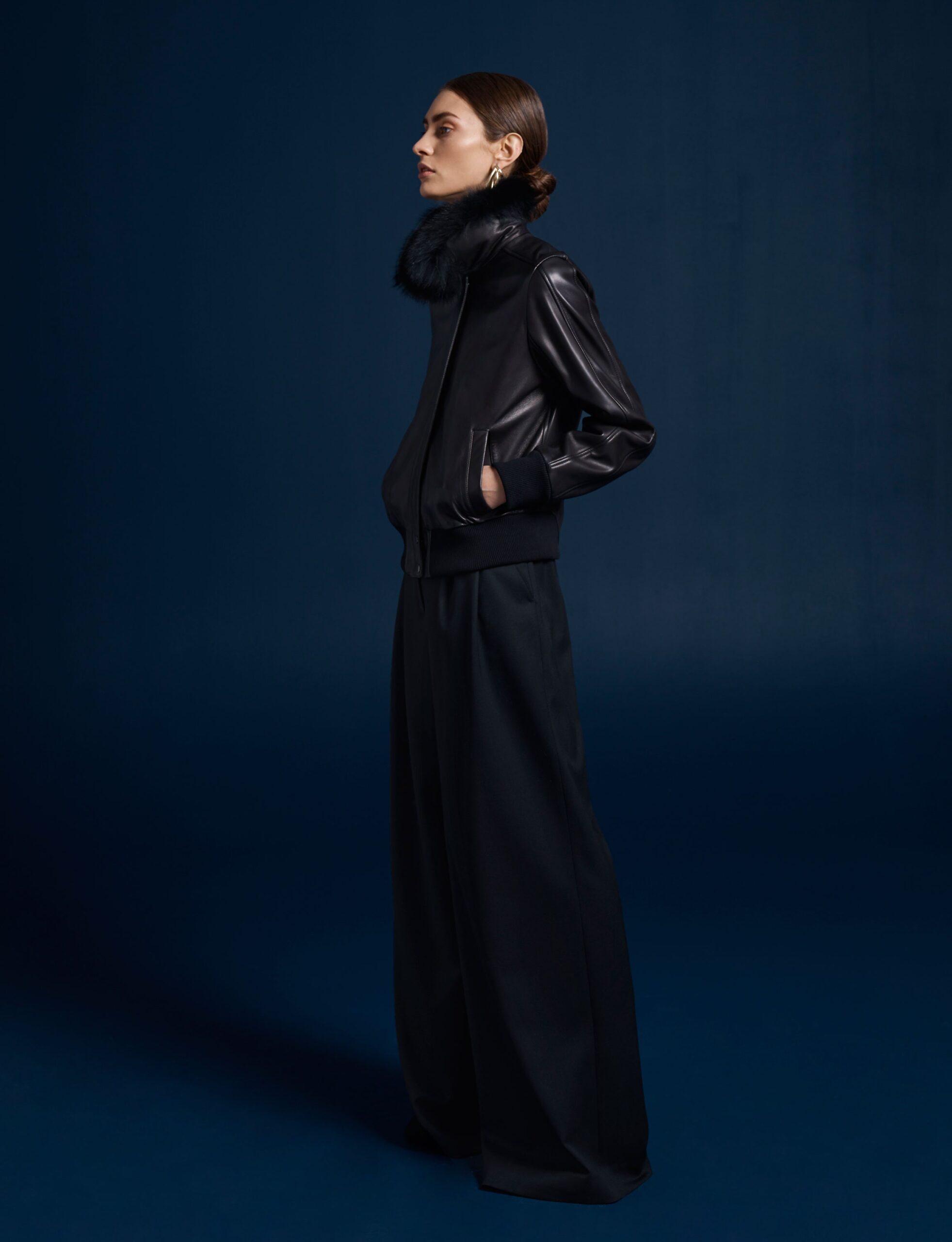 black leather long-sleeve collared fitted zippered jacket