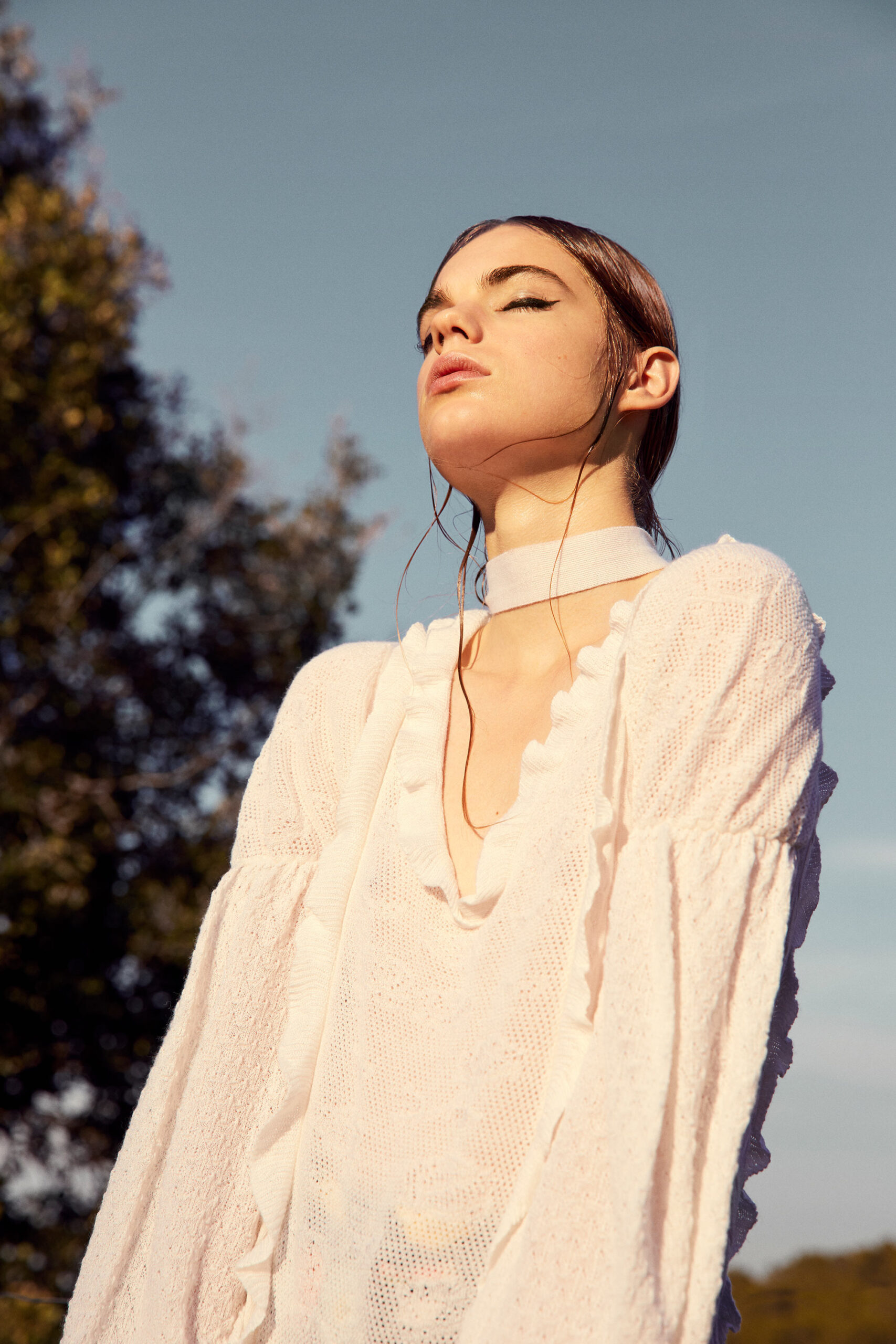white relaxed ruffled blouse