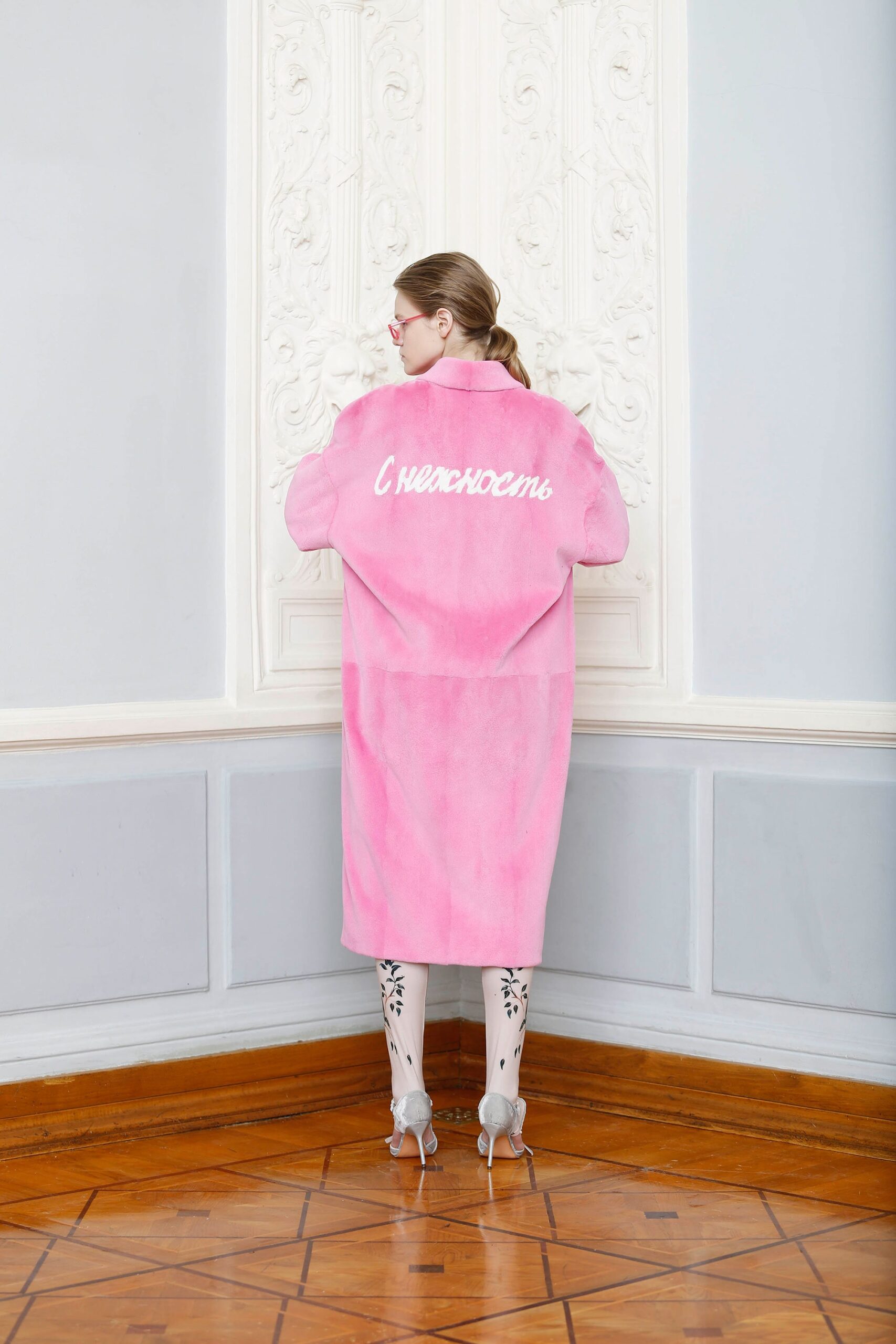 pink faux-fur coat with floral stockings