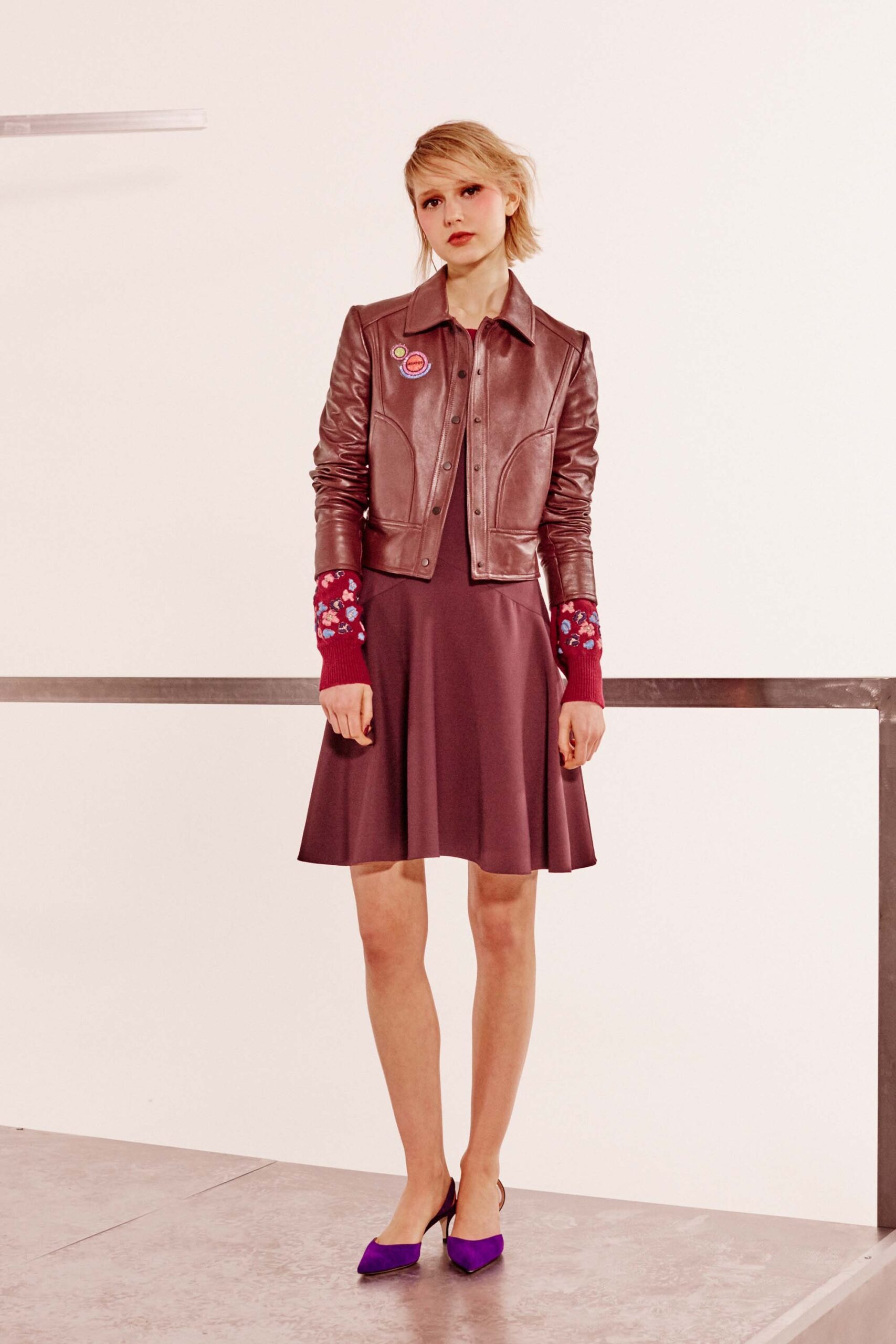 brown leather fitted jacket and purple dress