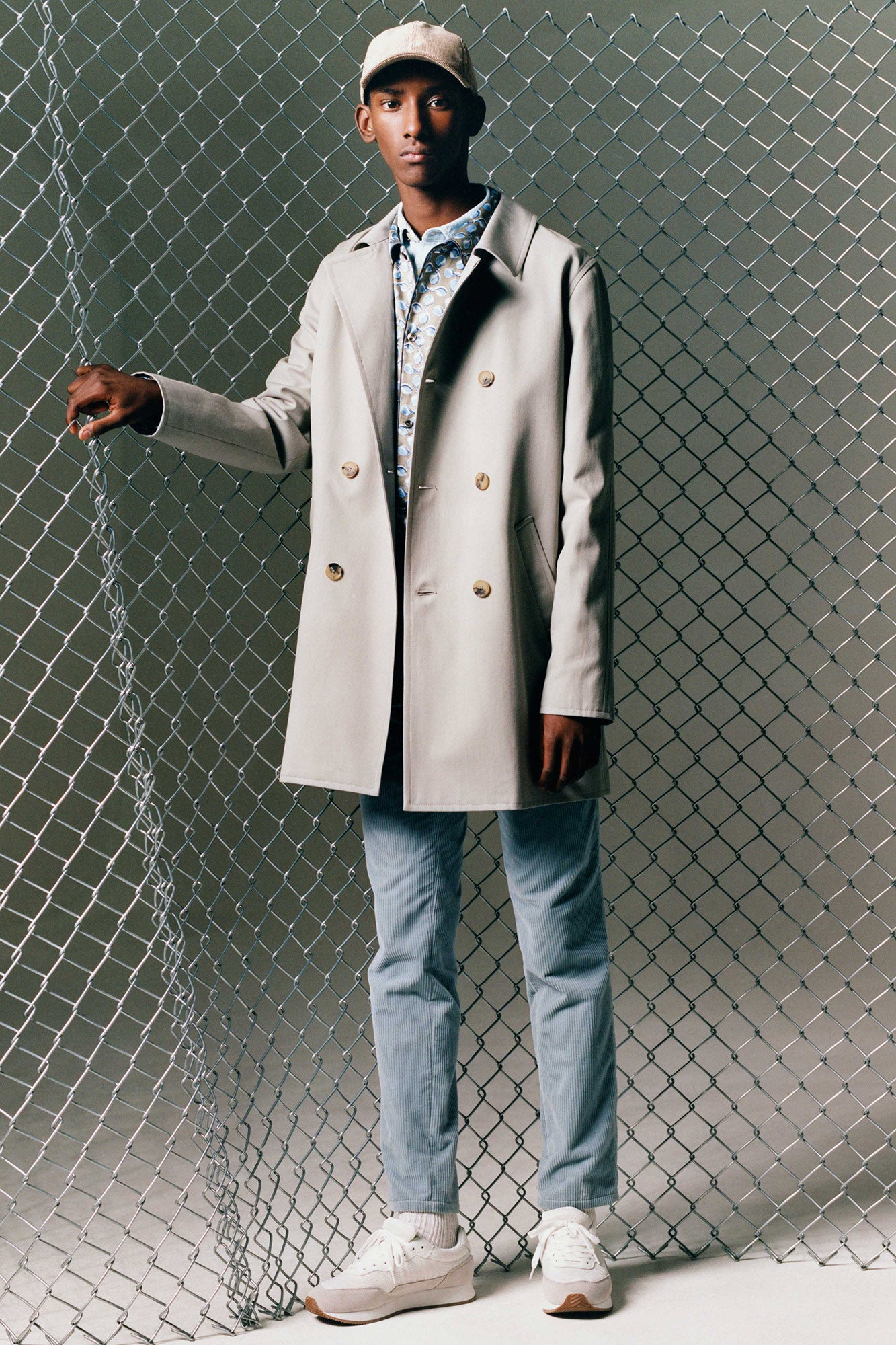 beige coat with printed shirt