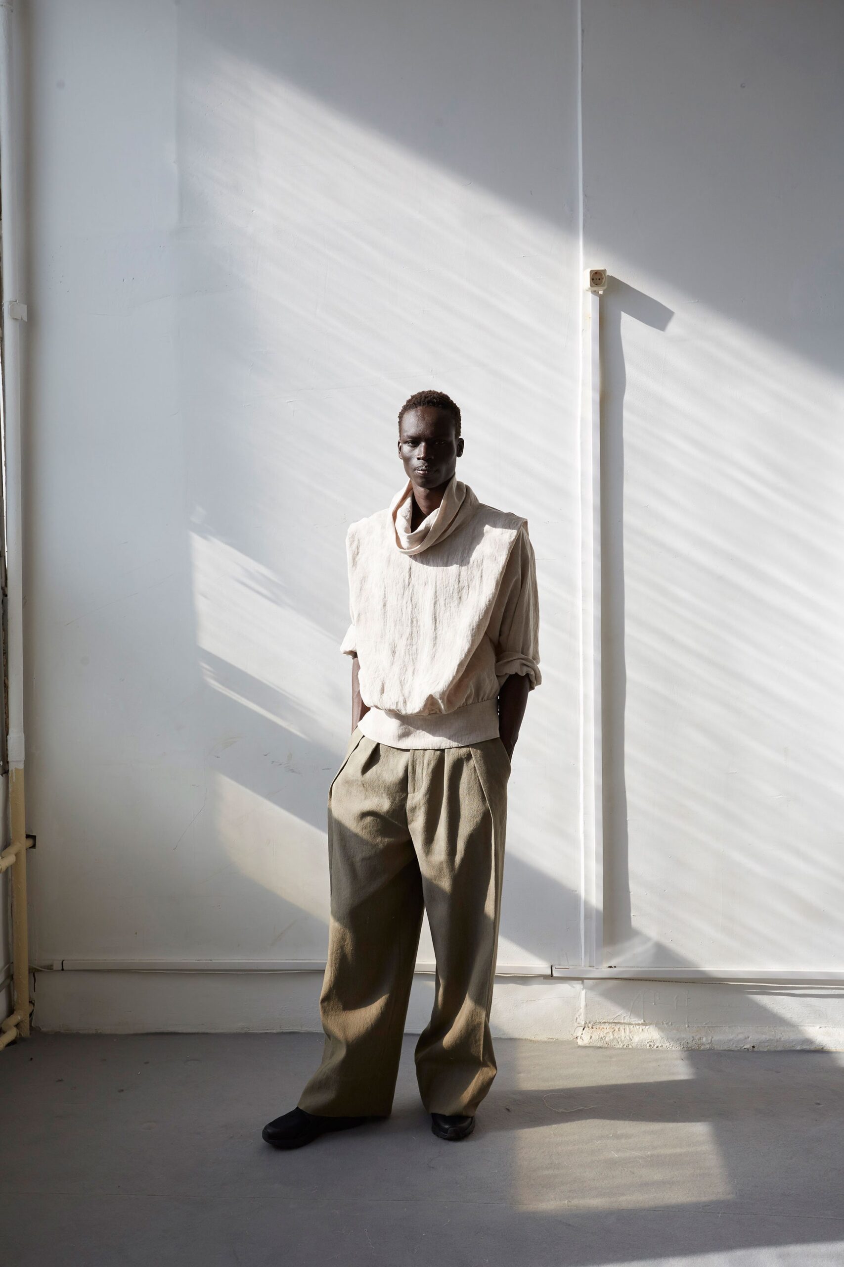 beige relaxed top with gray pants