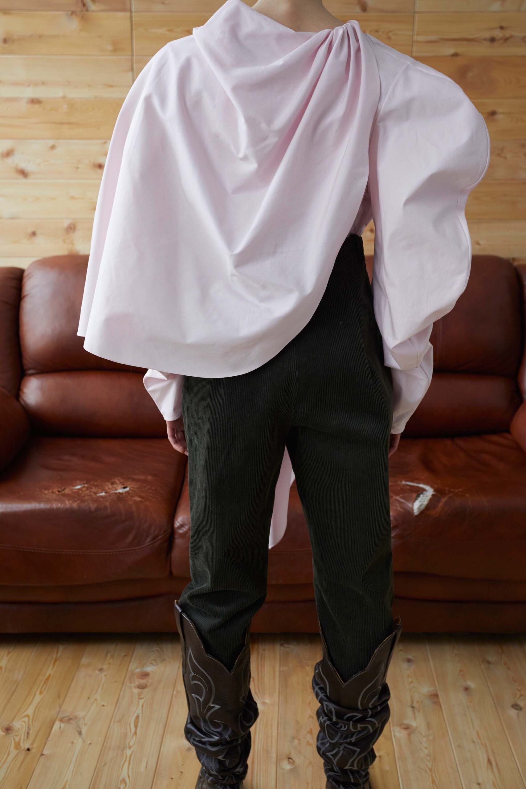 pink draped top green pants brown boots