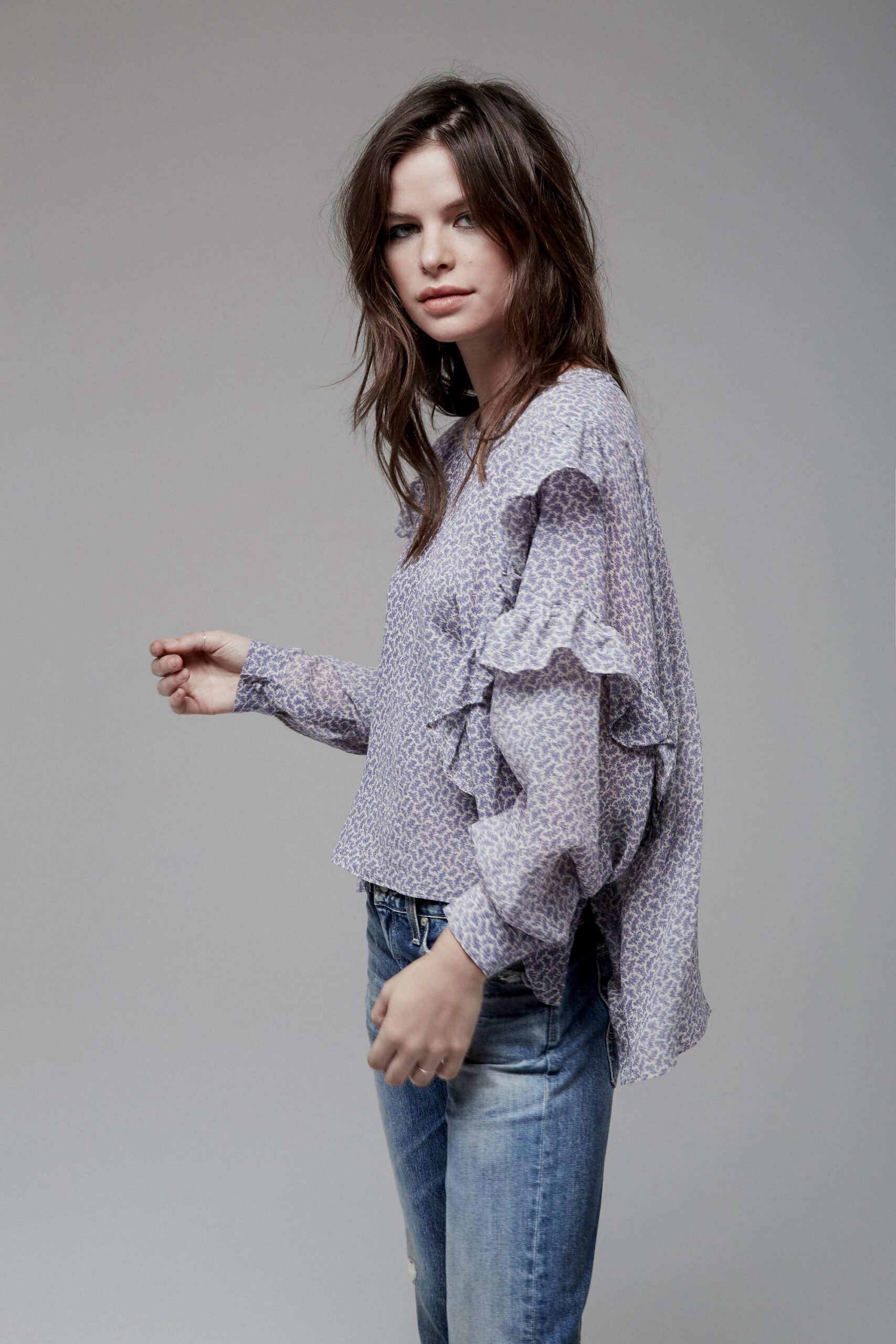purple ruffled blouse with jeans