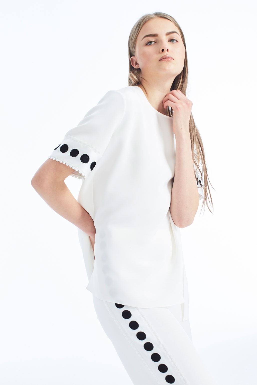 white fitted top and pants