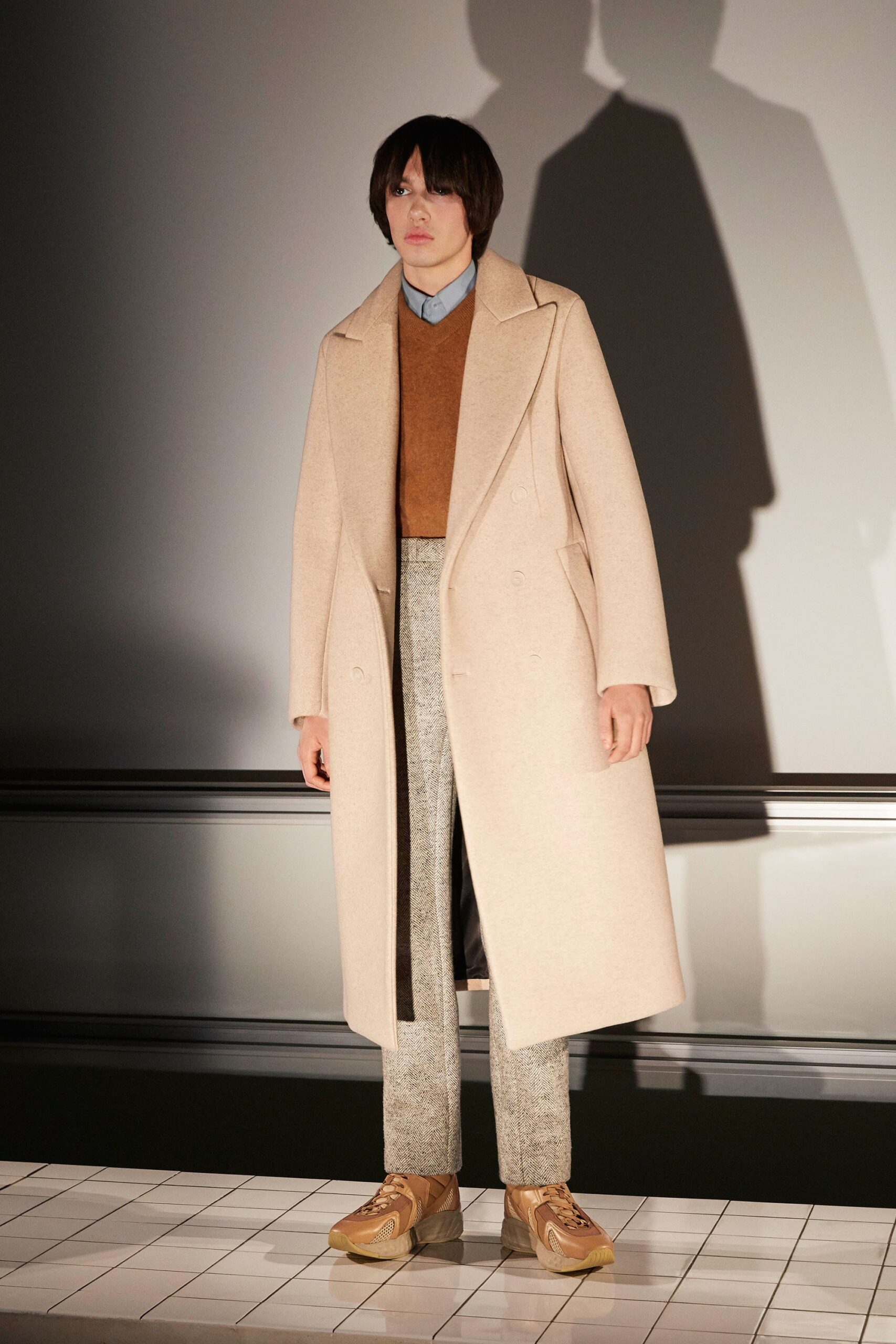 beige wool coat with brown sweater