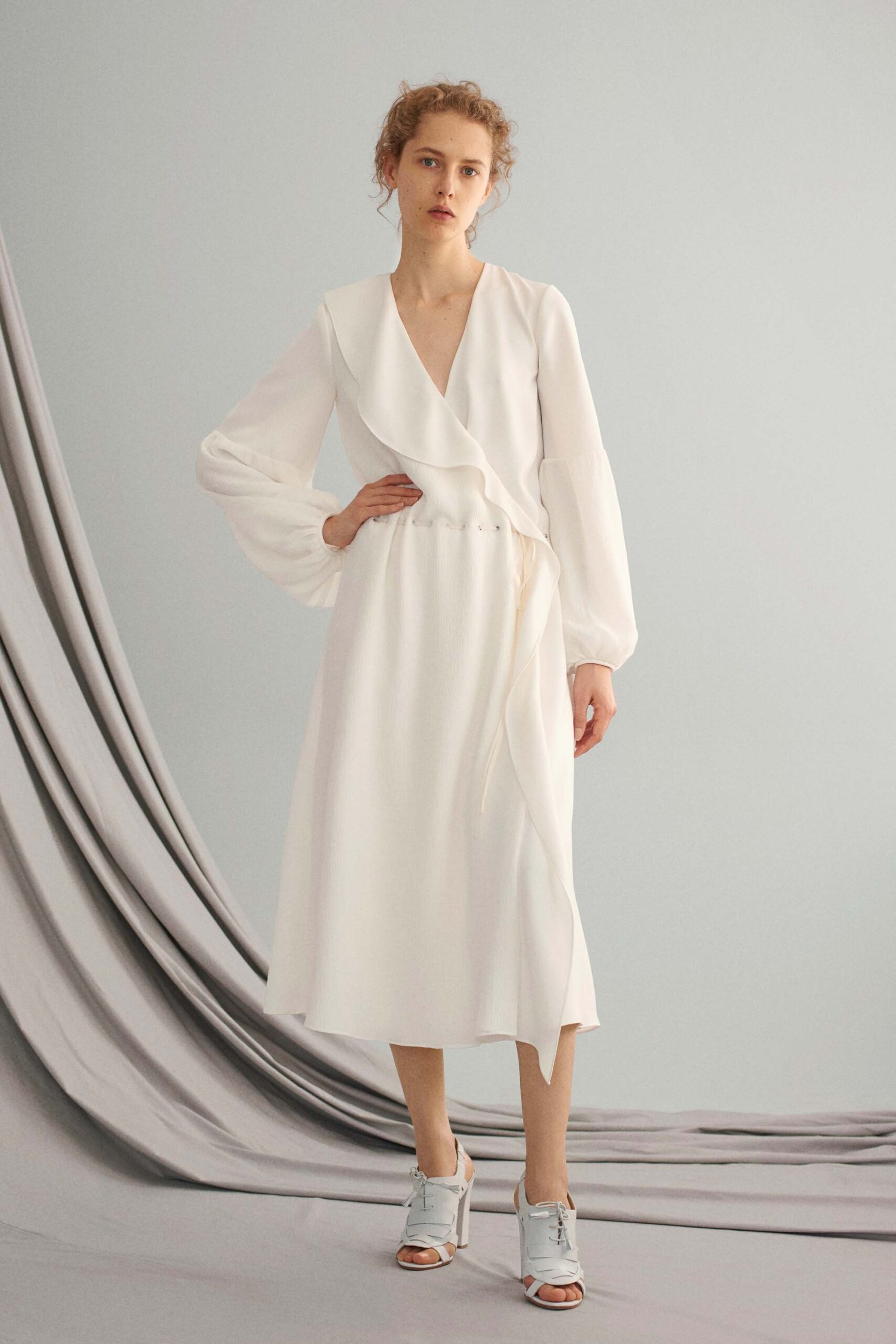 white silk long-sleeve dress