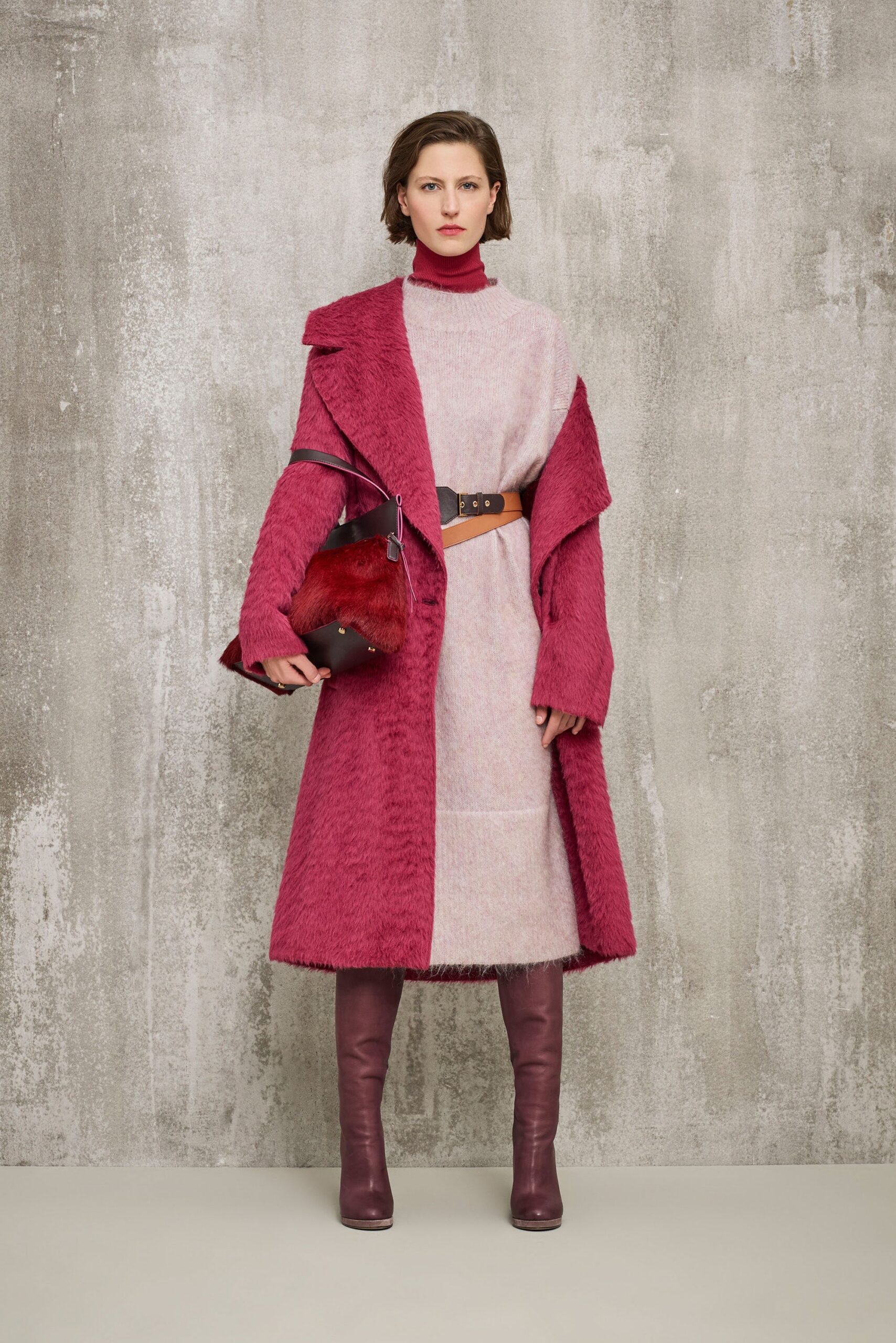 pink faux-fur coat with beige dress