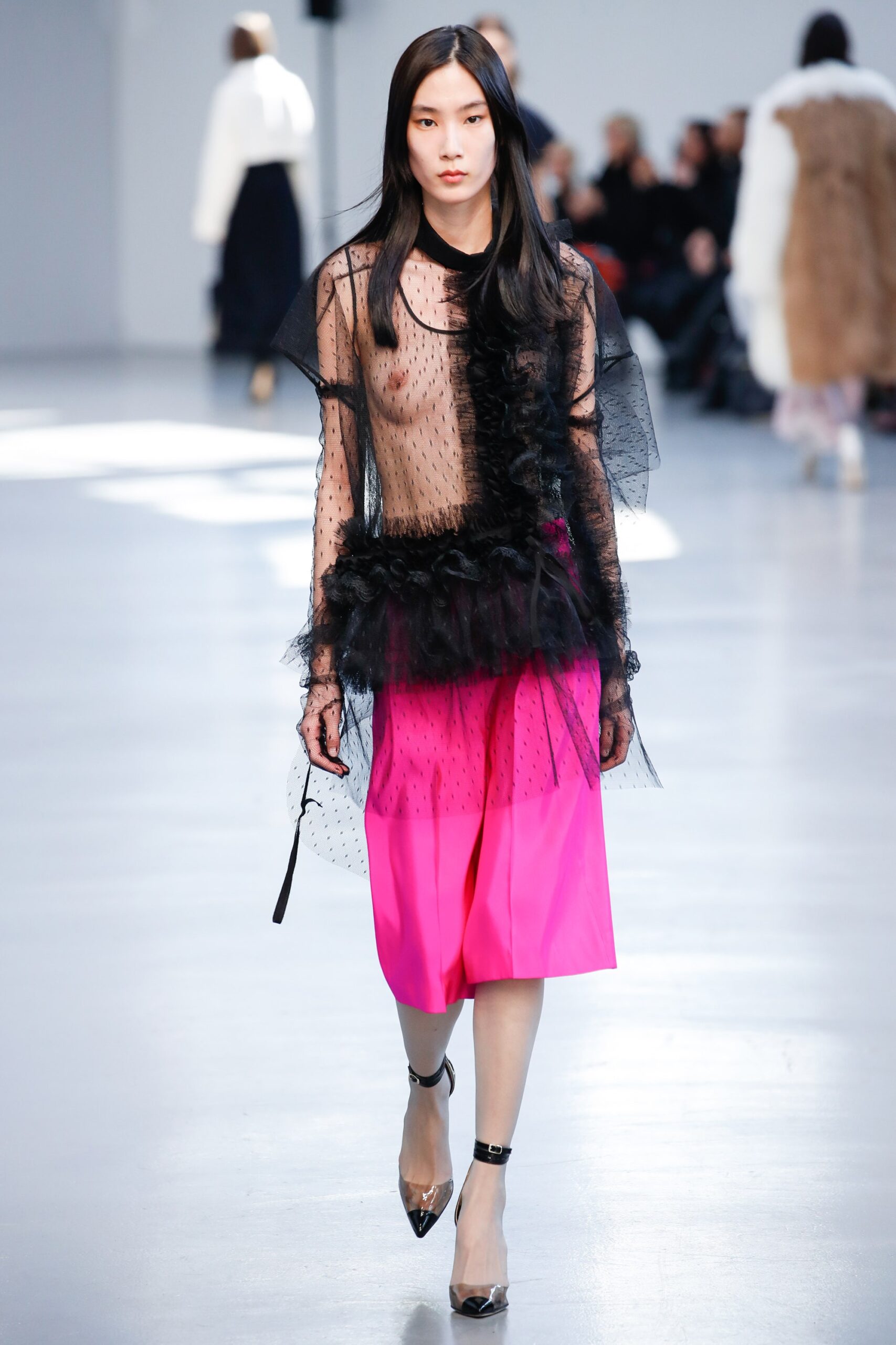 black sheer ruffled top with pink midi skirt